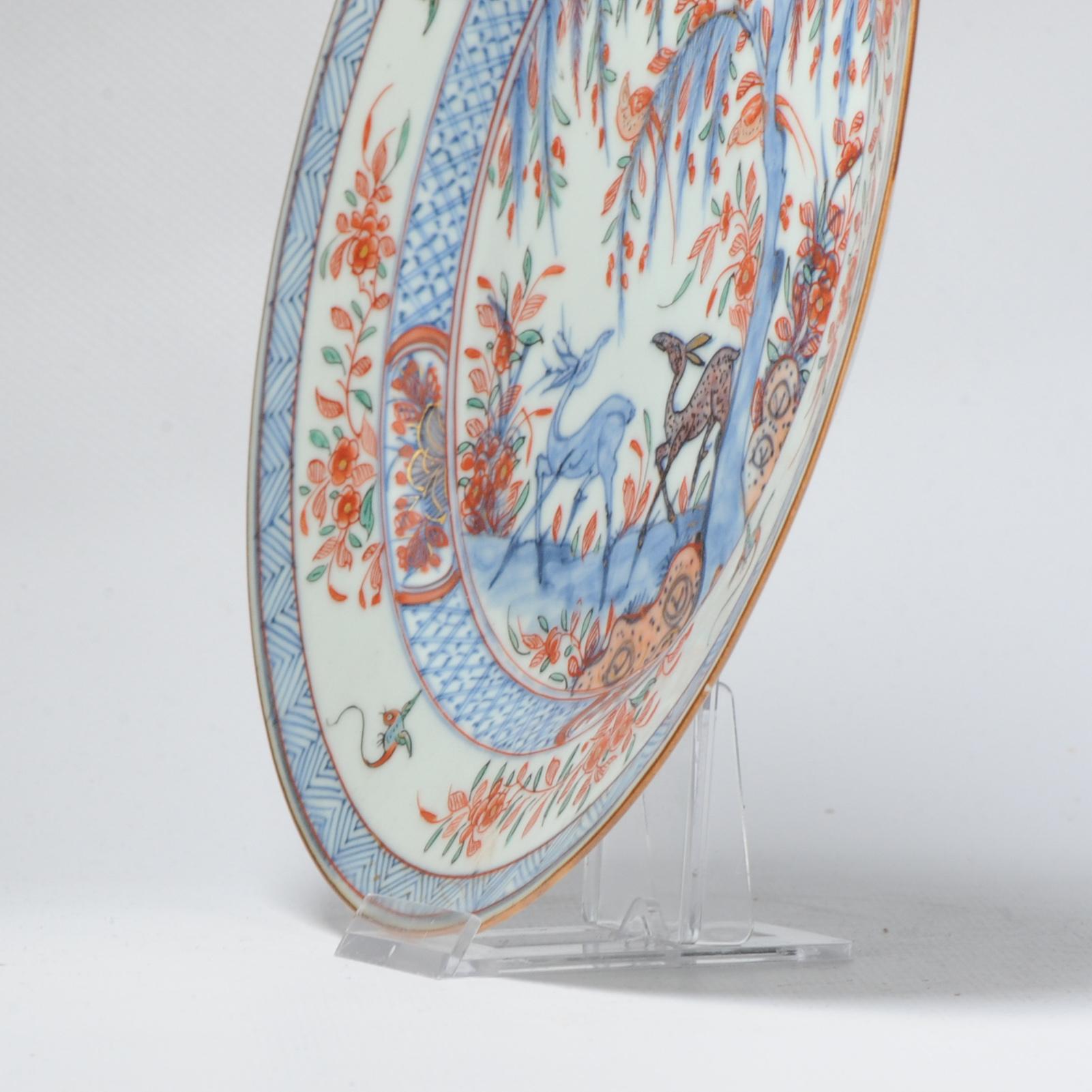 A very nicely made piece of 18th century Qianlong Amsterdam Bont porcelain decorated with deer, birds, flowers and trees. Underglaze blue and overglaze other enamels. The small birds in the border are in Kakiemon design.

Additional