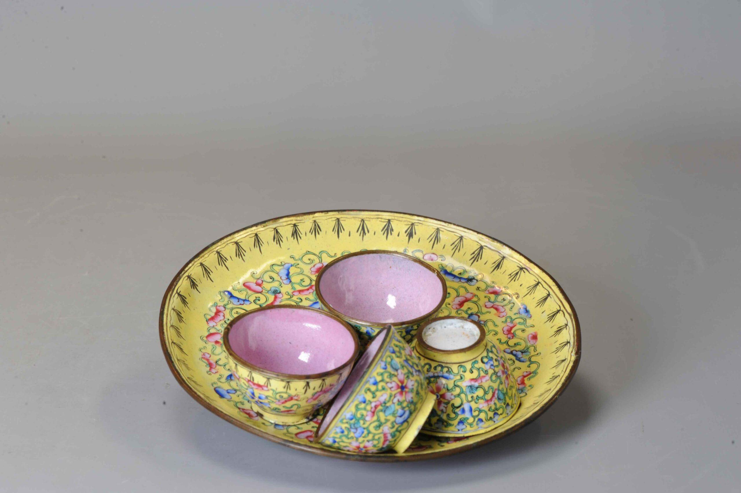 Lovely set of wine cups with serving dish. Floral design on a yellow ground. The base and inside in pink. Enamel on bronze. Canton Qianlong.

Additional information:
Material: Bronze & Cloisonne
Region of Origin: China
Emperor: Qianlong