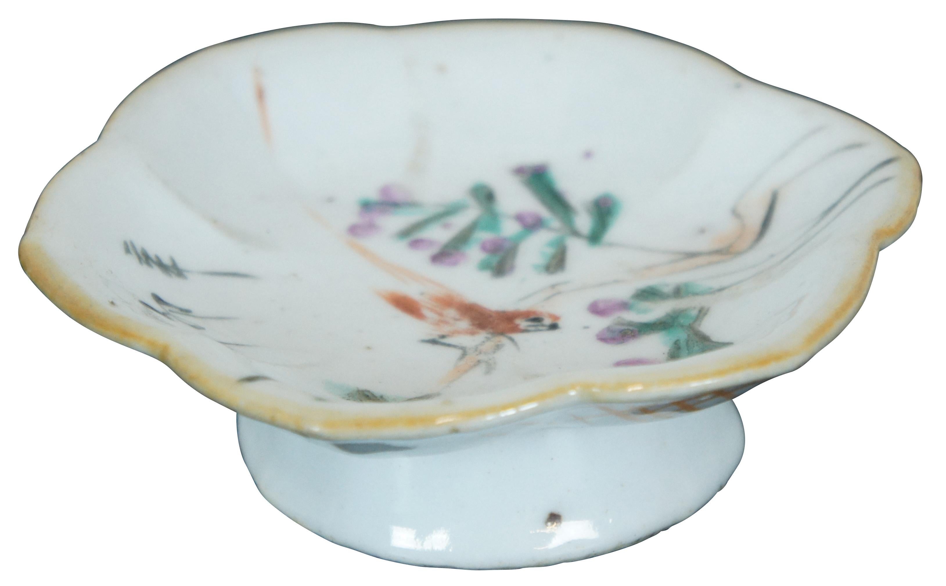 Antique late 19th – early 20th century Chinese export footed porcelain dish with a lotus flower shape, painted with a bird perched on flowering branches.