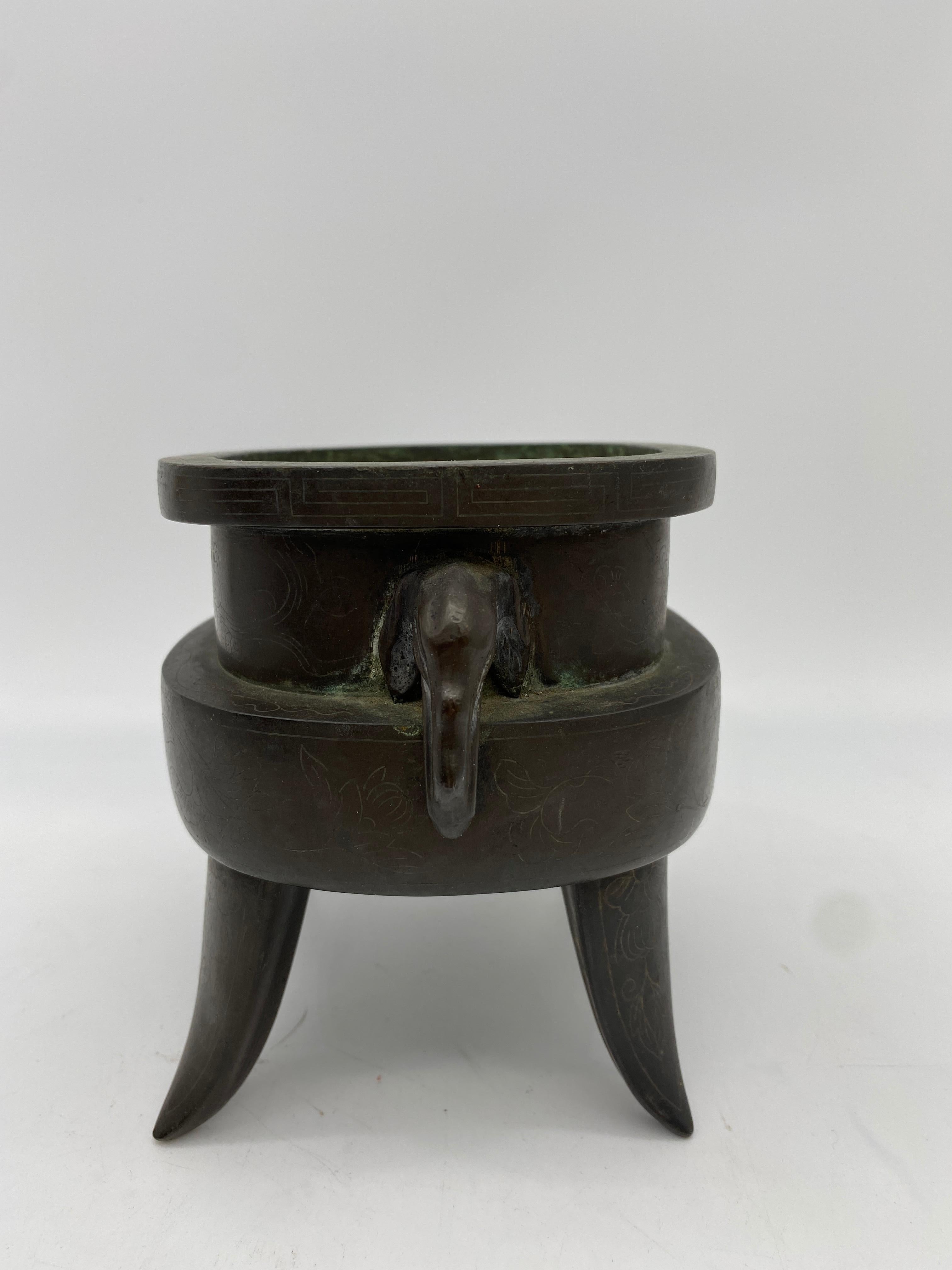 Qing dynasty 18th/19th century Chinese twin handled bronze censer with elephants handles, inlaid with fine silver work, 15cm x 11cm.