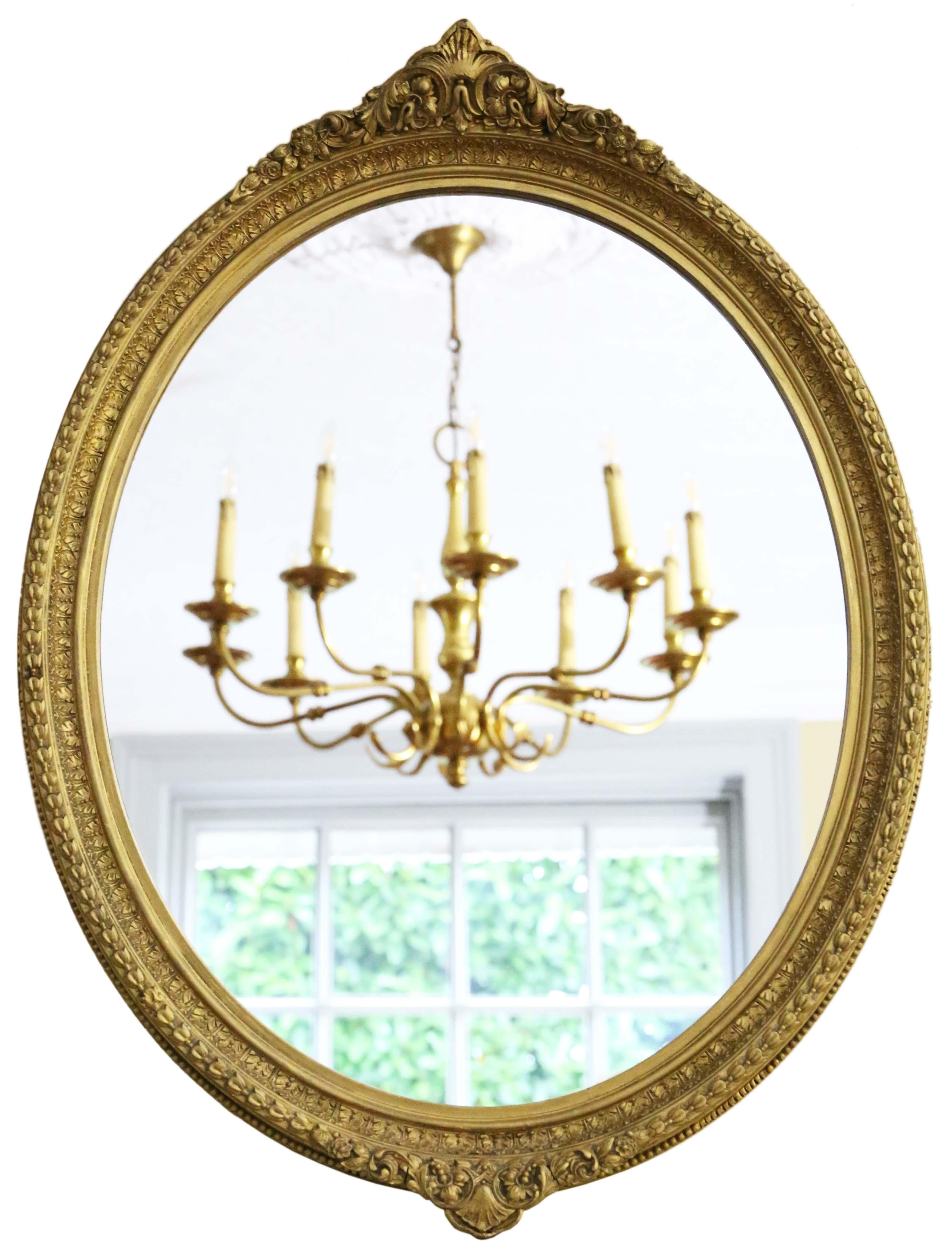 Antique quality oval gilt overmantle wall mirror 19th Century.

An impressive rare find, that would look amazing in the right location. No loose joints or woodworm.

The replacement mirrored glass is in very good condition.

The frame has minor