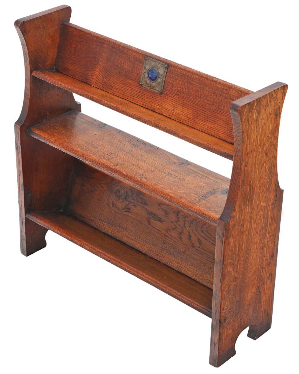 Antique, high-quality Art Nouveau oak bookcase book trough stand circa 1910, crafted in the manner of Liberty.

This piece is solid and robust, boasting no loose joints or woodworm. A charming and rare quality find.

Sure to make a statement in the
