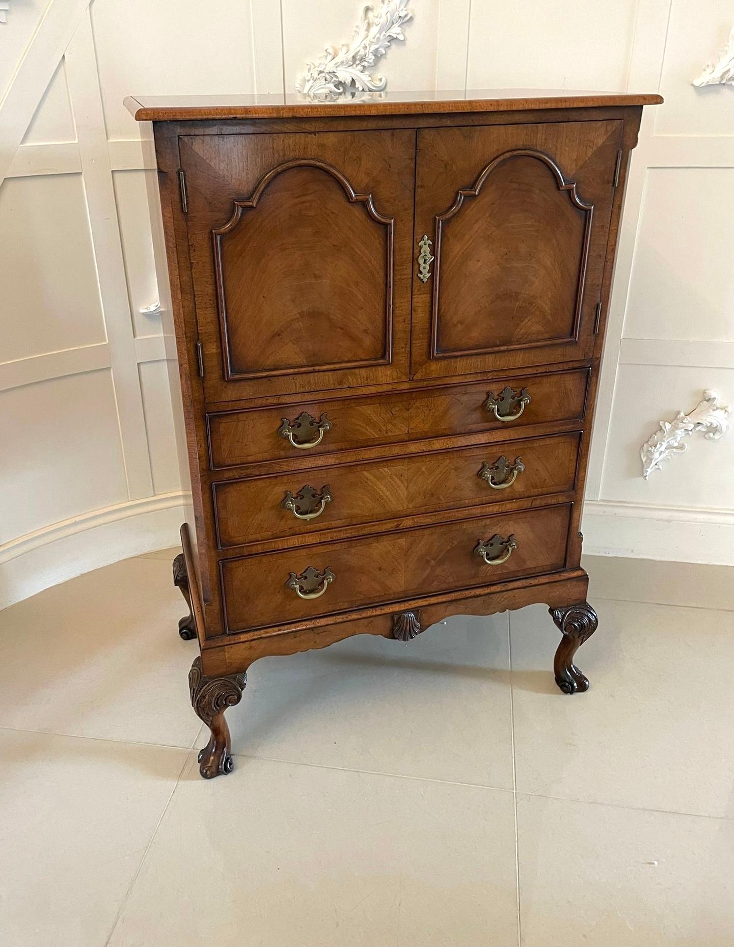 Antique quality burr walnut chest on stand having a quality crossbanded burr walnut top with a moulded edge above a pair of crossbanded burr walnut moulded doors opening to reveal a storage compartment above three long crossbanded burr walnut