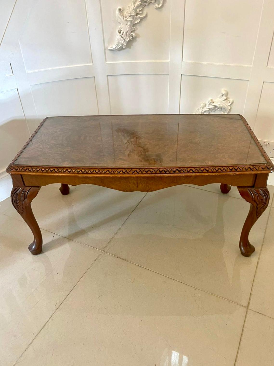 Antique quality burr walnut coffee table having a quality burr walnut and glass shaped top with a carved edge, serpentine shaped apron standing on shaped carved walnut cabriole legs with pad feet 


In lovely original condition boasting an