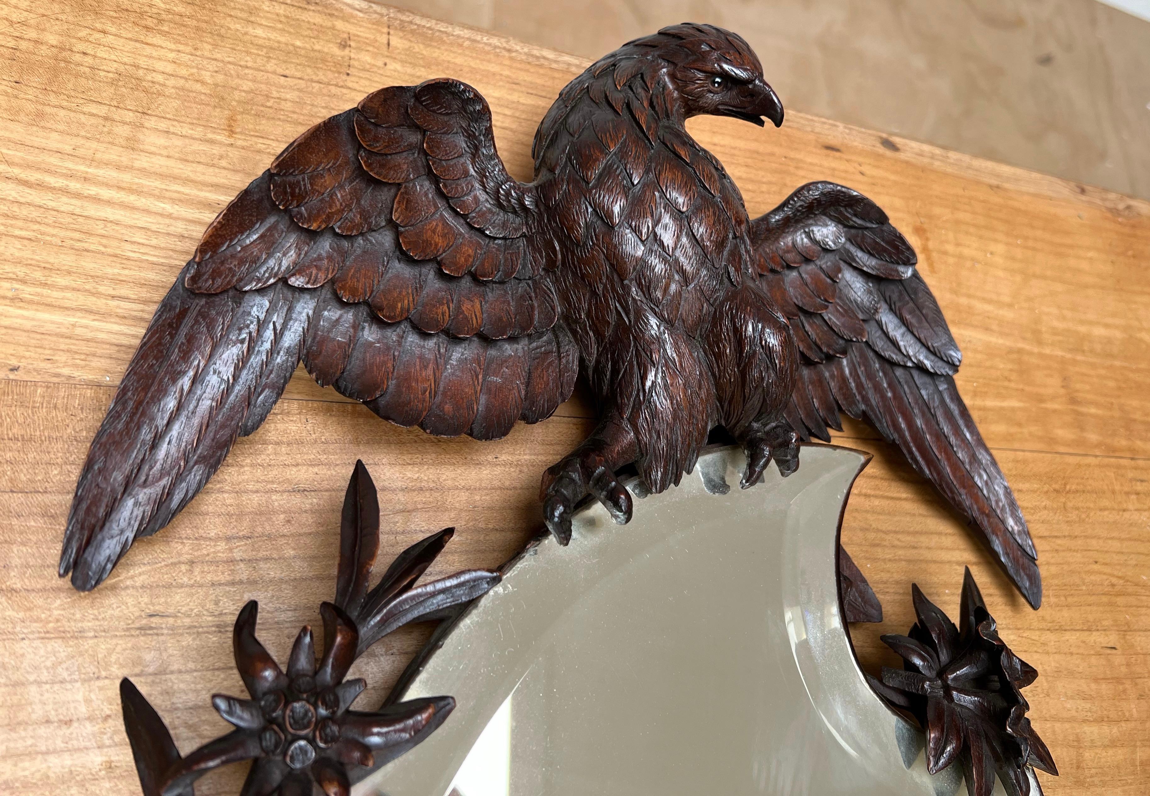 Rare, beautifully carved nutwood and highly decorative wall mirror.

If you are appreciative of rare and sculptural antiques then this Swiss BF mirror could be yours to own and enjoy soon. The quality and the patina of this winged eagle sculpture