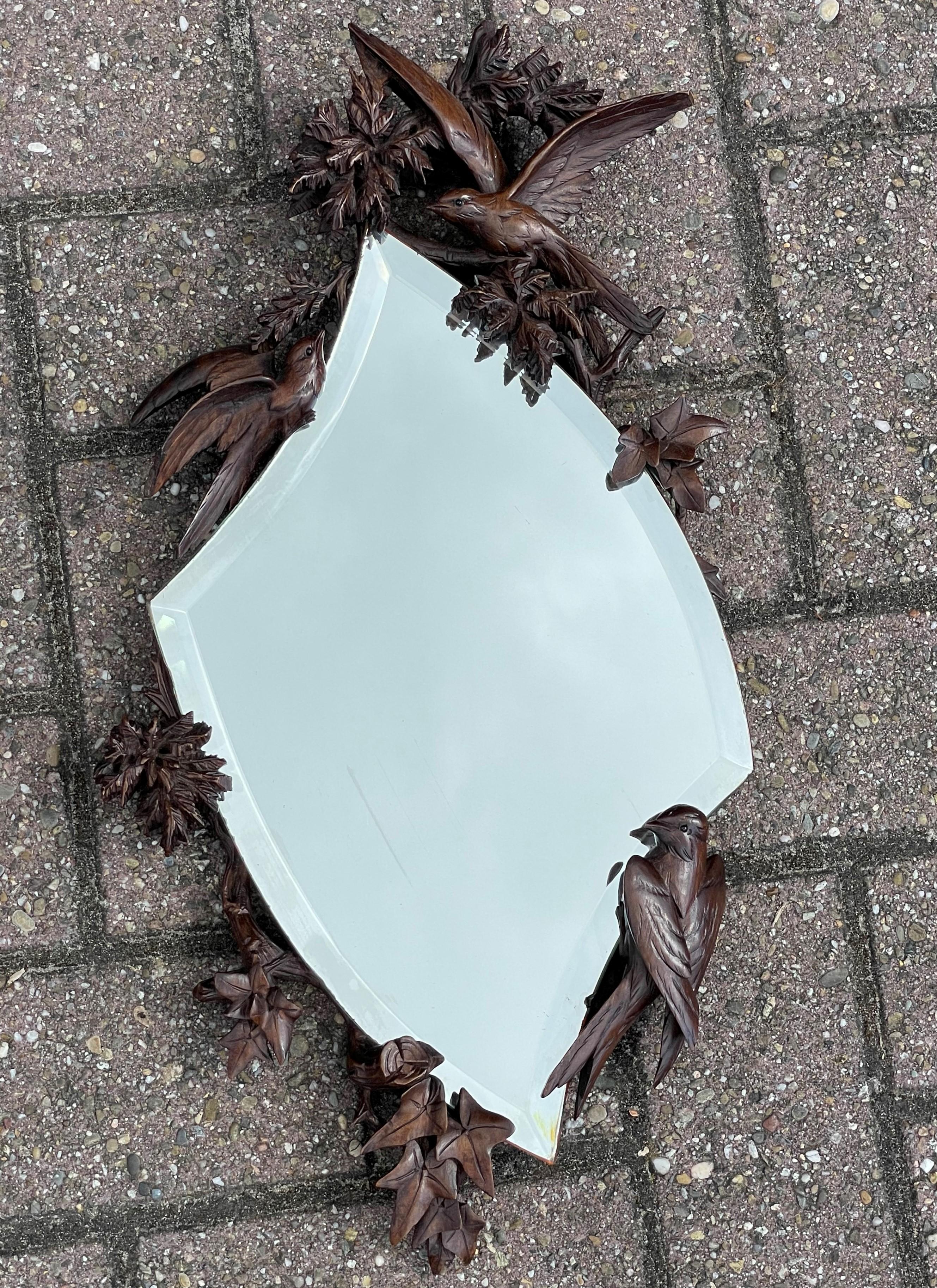 Rare, beautifully carved and highly decorative wall mirror.

If you are appreciative of rare and sculptural antiques then this Swiss BF mirror could be exactly what you are looking for. The quality and the patina of this swallow sculptures mirror