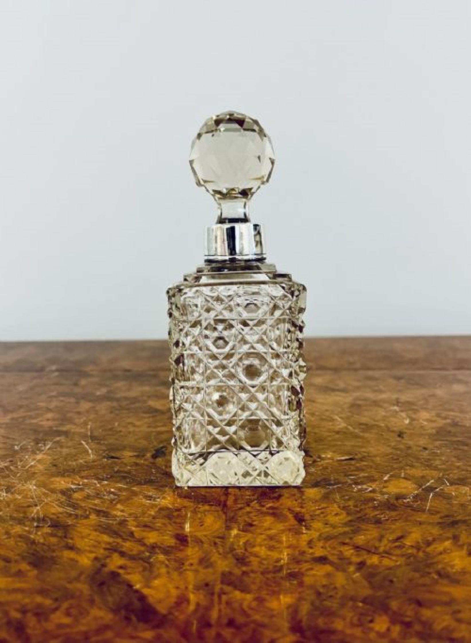 Antique quality cut glass decanter with the original stopper and a silver plated collar