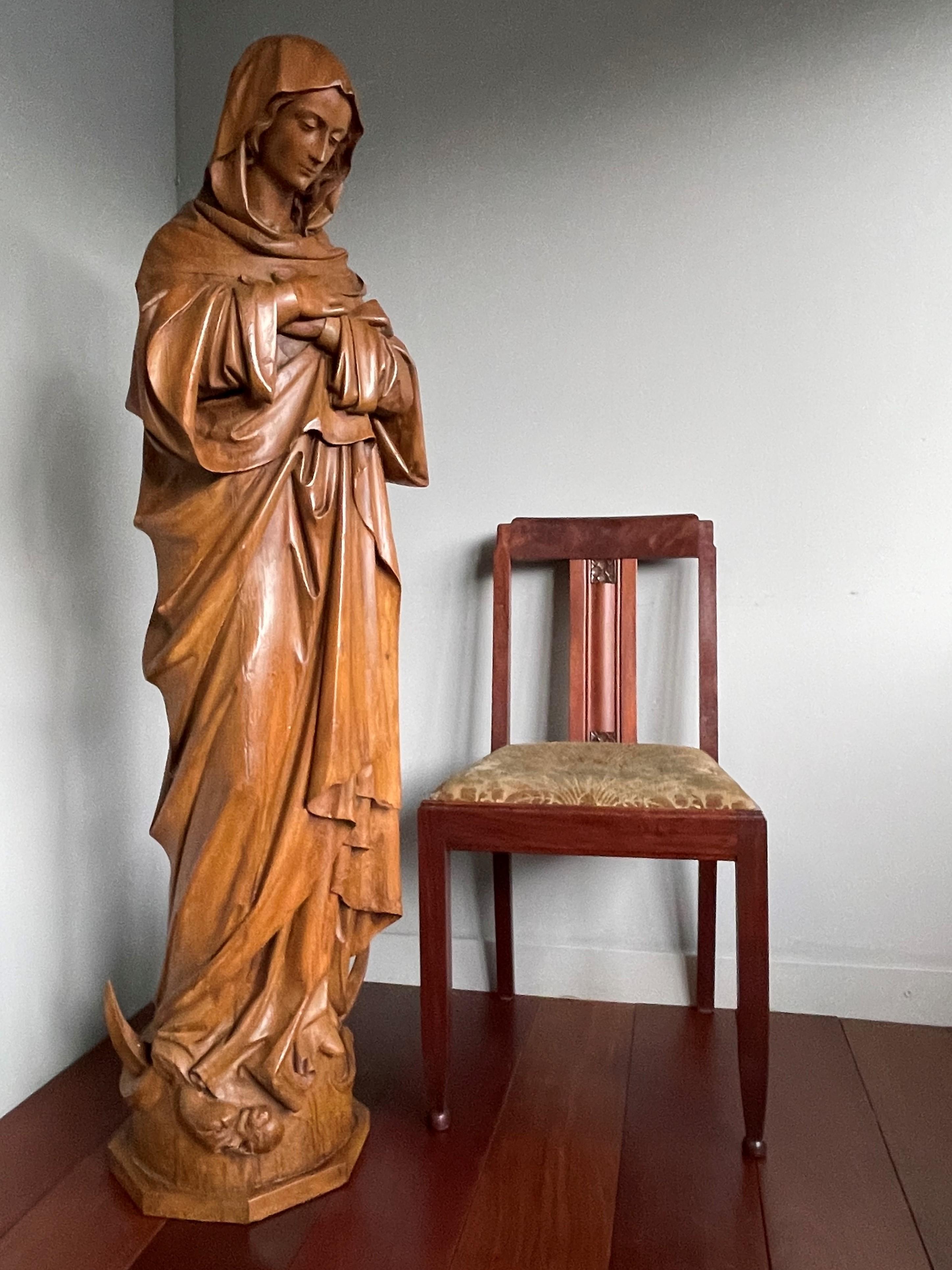 Stunning, late 1800s, wooden sculpture of a serene Mary with folded hands.

This stunning church relic is another great example of the quality of 19th century, European craftsmanship and we are grateful for it to have found its way to our gallery.