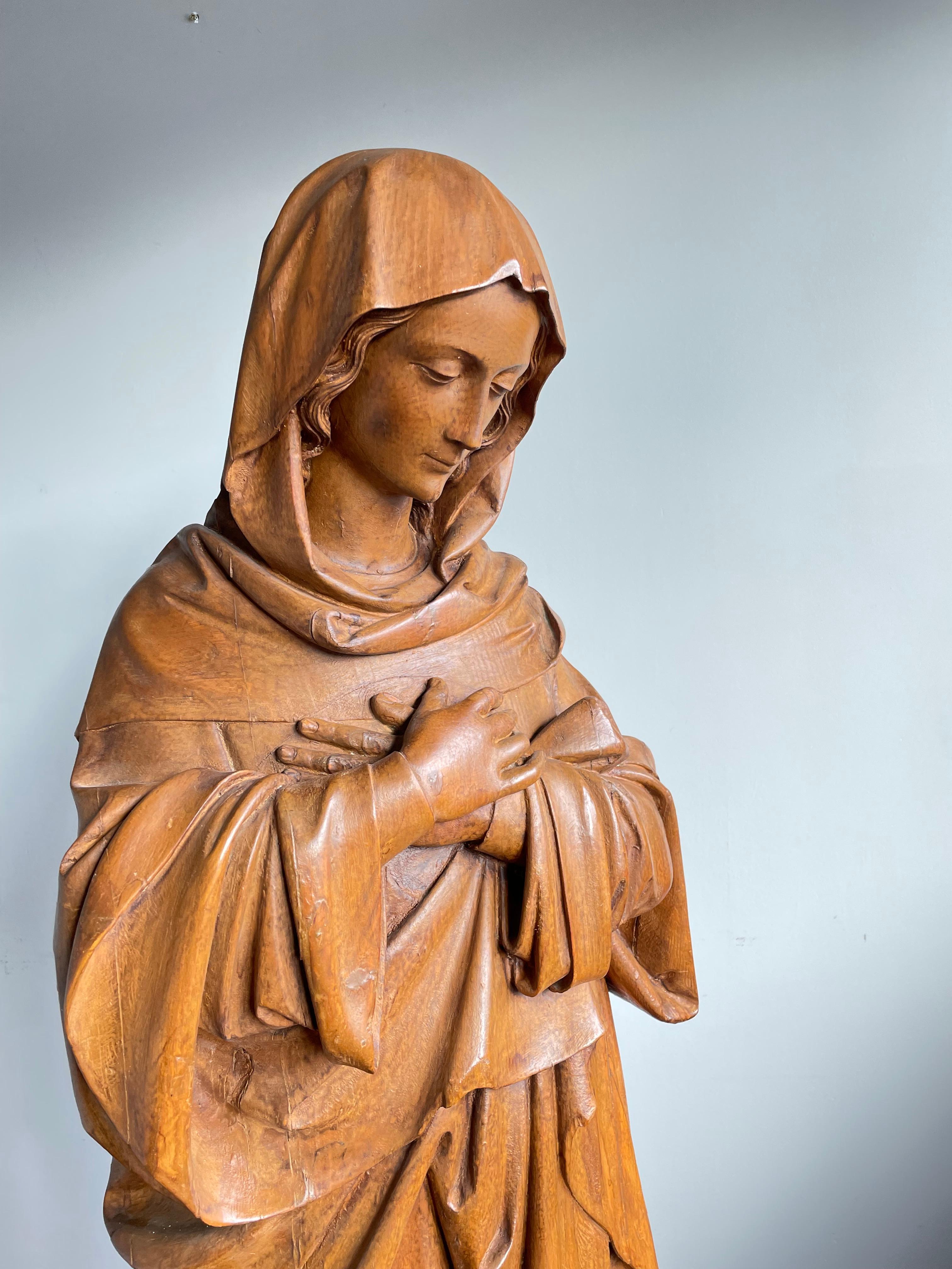 mary stepping on snake statue name