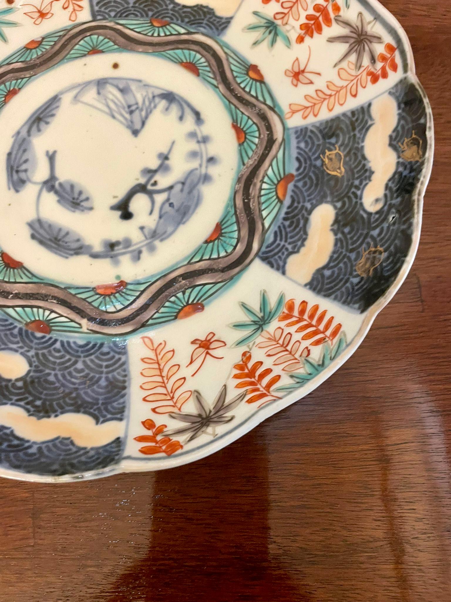Antique quality Japanese Imari plate having a scalloped edge with wonderful hand painted panels in red, blue, green, white and gold colours 


In lovely original condition


Dimensions:
Height 3.5 cm 
Width 22 cm 
Depth 22 cm


Dated 1900 
