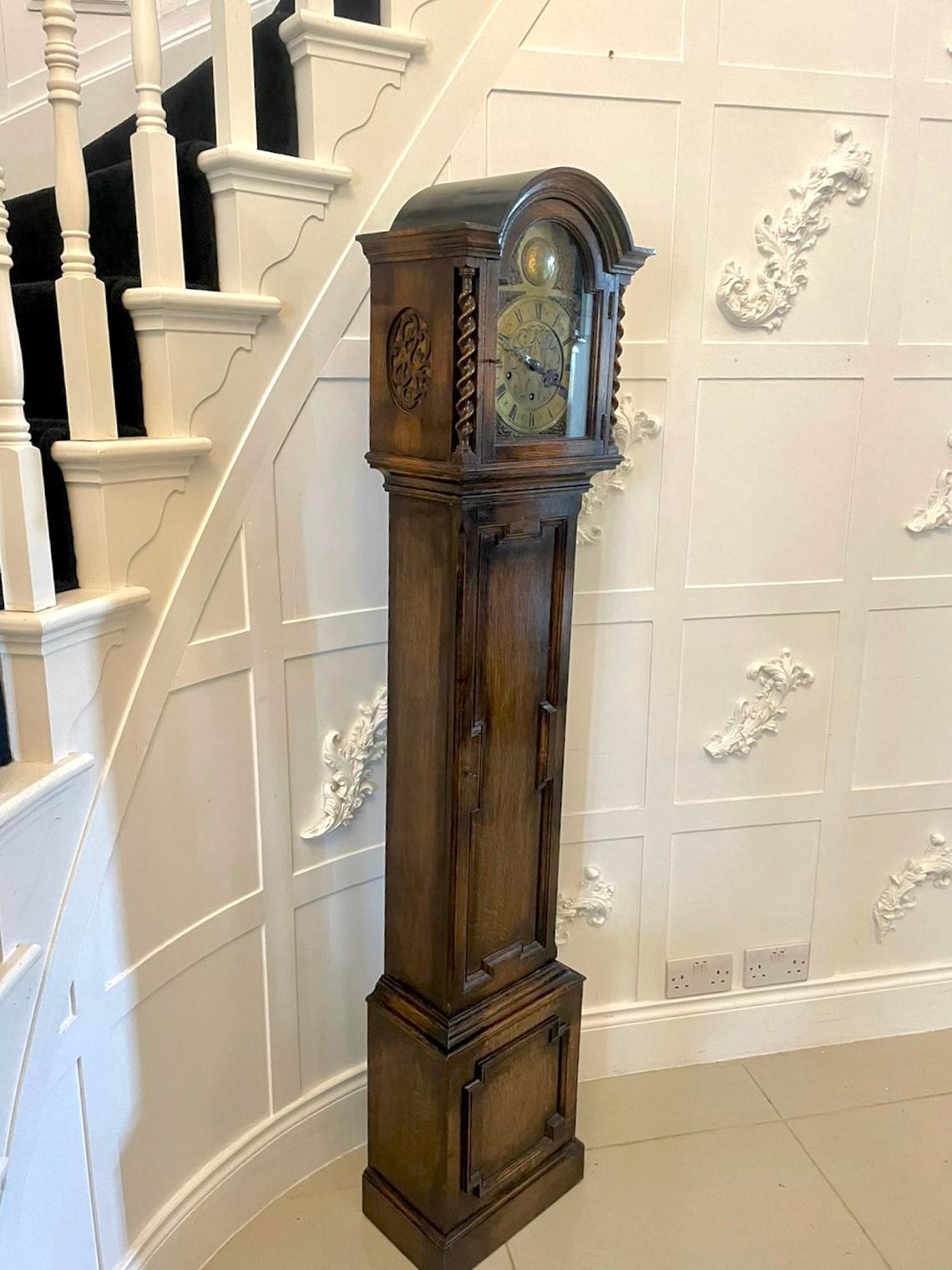Antique quality oak brass face Eight day chiming grandmother clock having a quality brass face with original hands,  eight day chiming movement every fifteen minute,  lovely Jacobean mouldings to the oak case standing on a plinth base


A charming