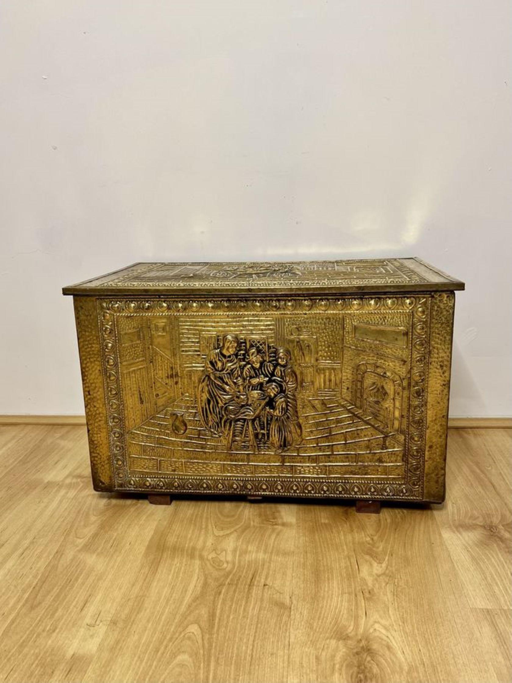 Antique quality ornate brass coal box having a quality ornate brass lift up lid with figures, foliage and trees opening to reveal a storage compartment for coal, ornate front and sides with figures and foliage.

D. 1920