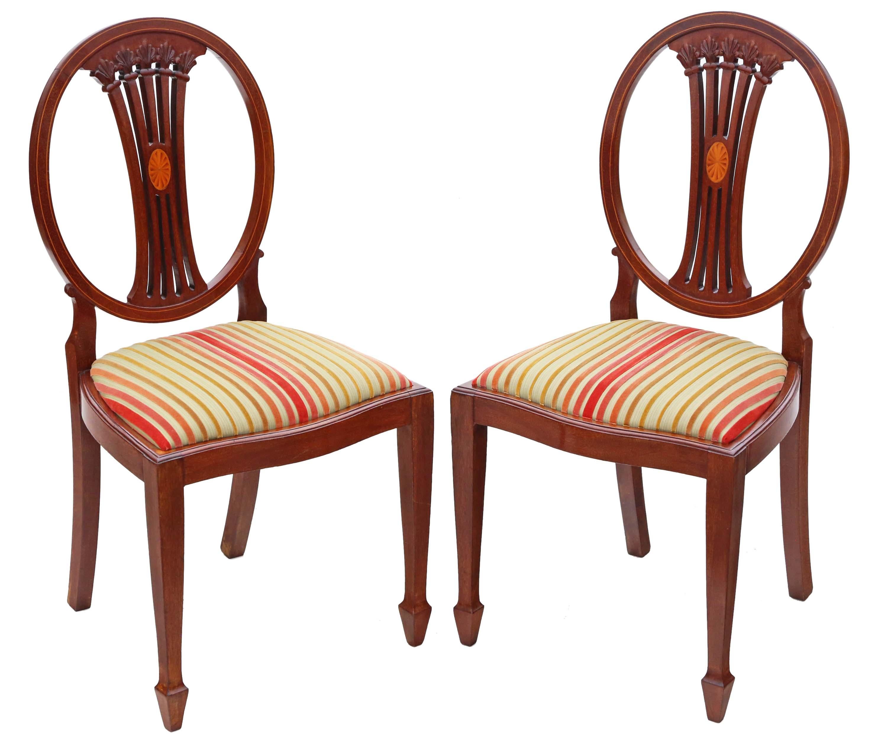 Antique quality pair of Georgian revival inlaid mahogany dining side hall bedroom chairs C1910.

Attractively carved with line and marquetry inlays. Recently restored to a very good standard.

Solid, with no loose joints and no woodworm.

As