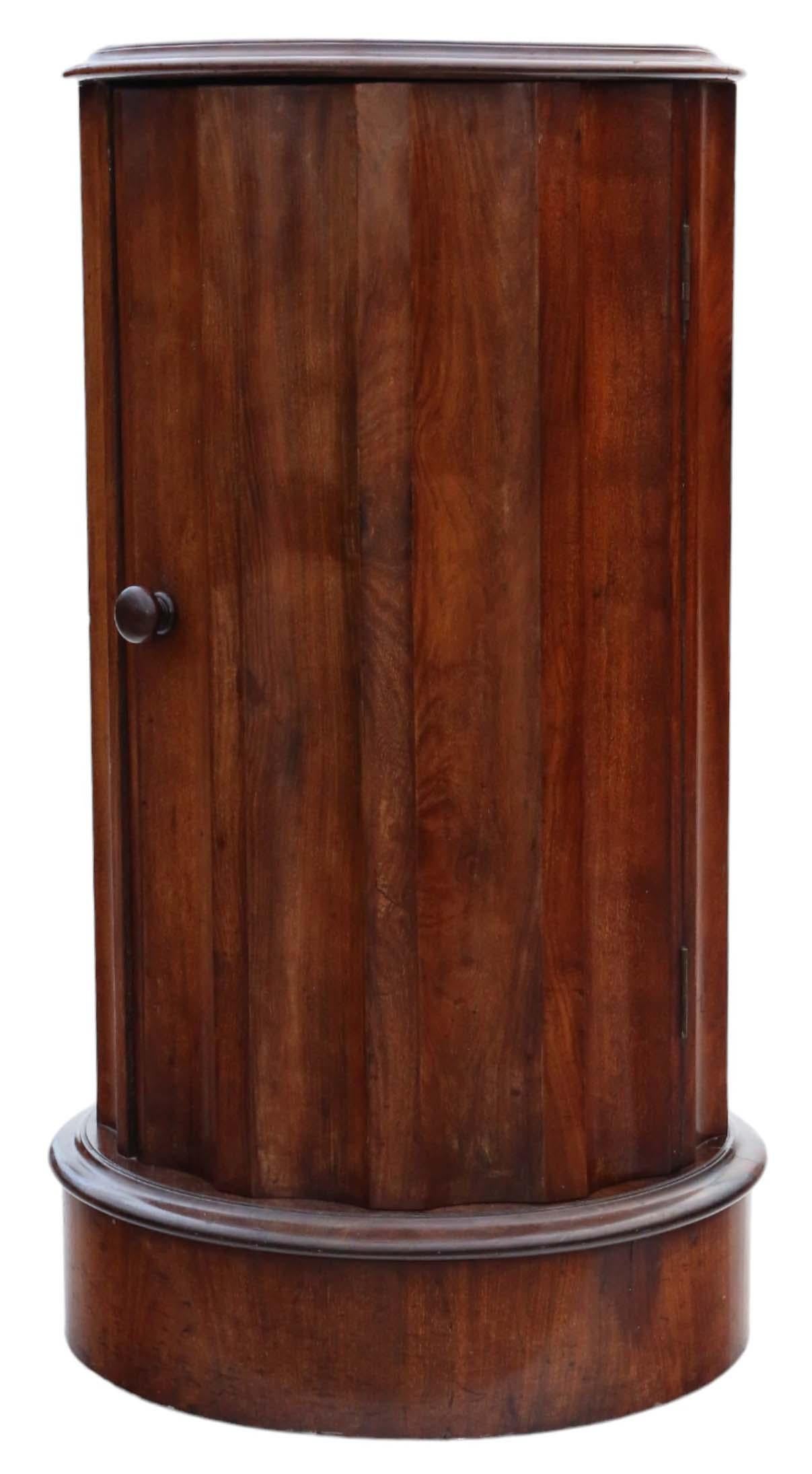 Antique 19th Century Victorian mahogany fluted cylinder bedside cupboard table cabinet of fine quality.

This cupboard is a delightful piece rich in age, charm, and character, known for its rarity and scarcity in the market.

Notably heavy and