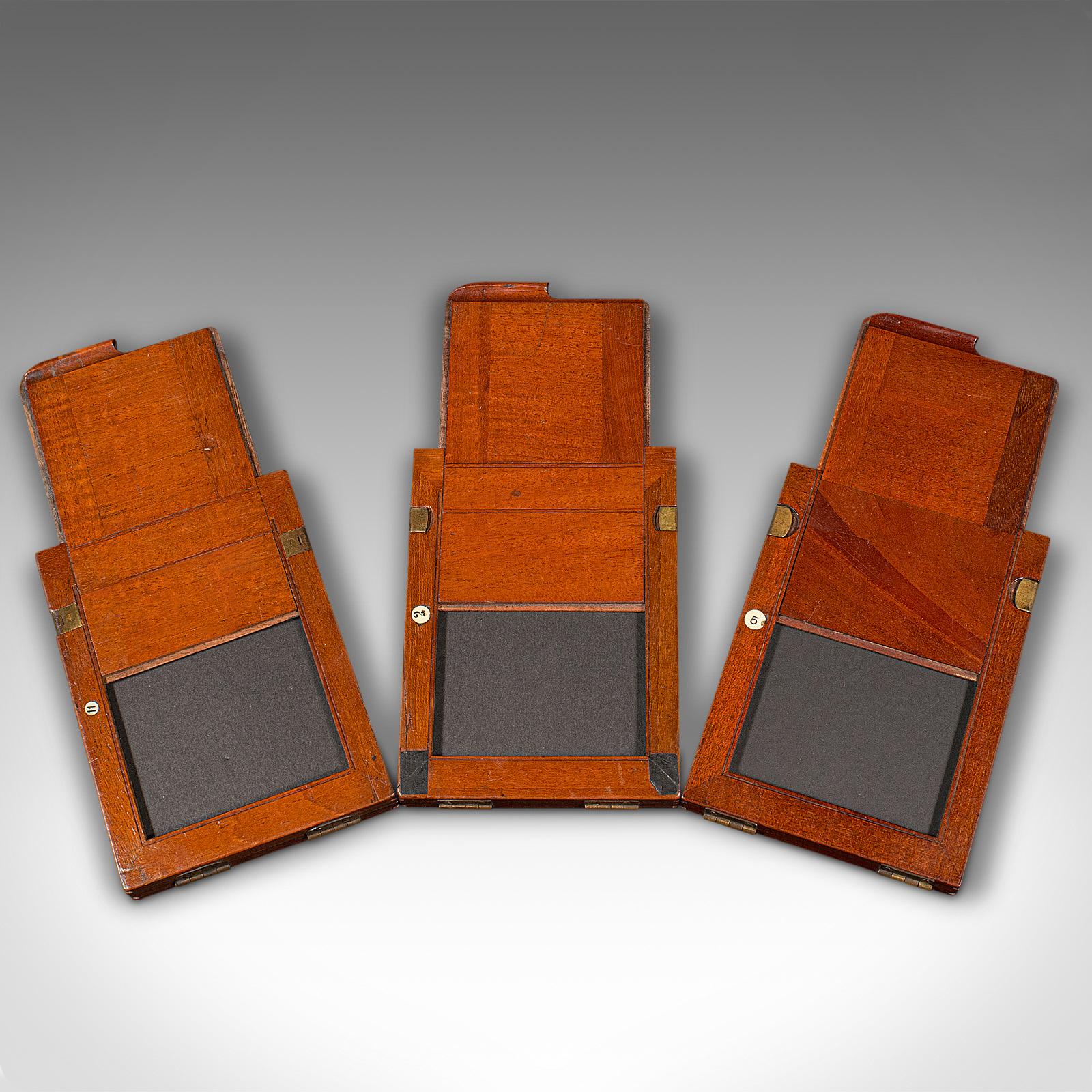 This is a set of 3 antique quarter plate film holders. An English, mahogany double dark photographic slide, dating to the late Victorian period, circa 1900.

A fascinating set of early photographic slides
Displaying a desirable aged patina and in