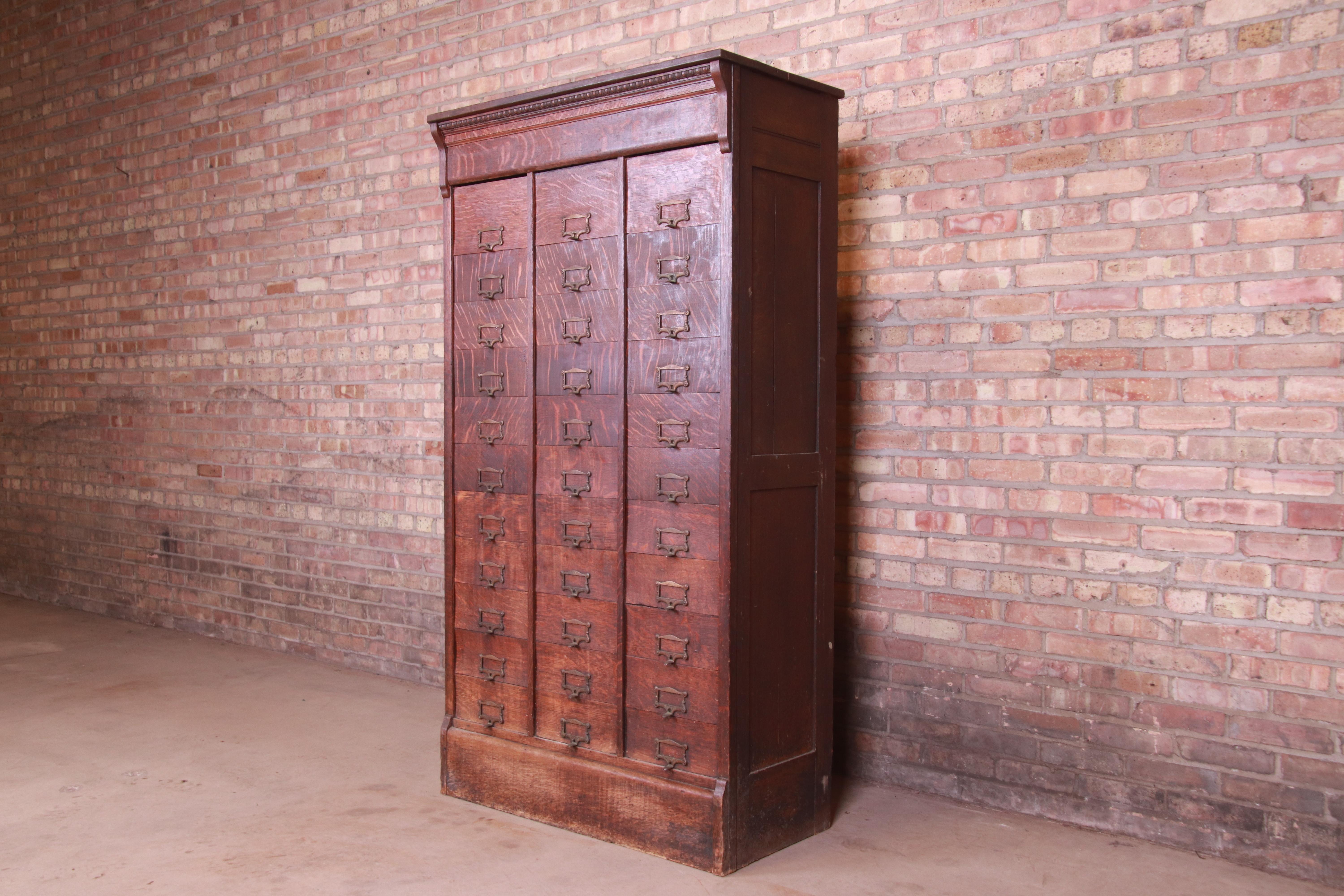 A rare and unique 19th century antique Arts & Crafts 33-compartment railroad file cabinet

USA, circa 1890

Quarter sawn oak, with original brass hardware.

Measures: 38