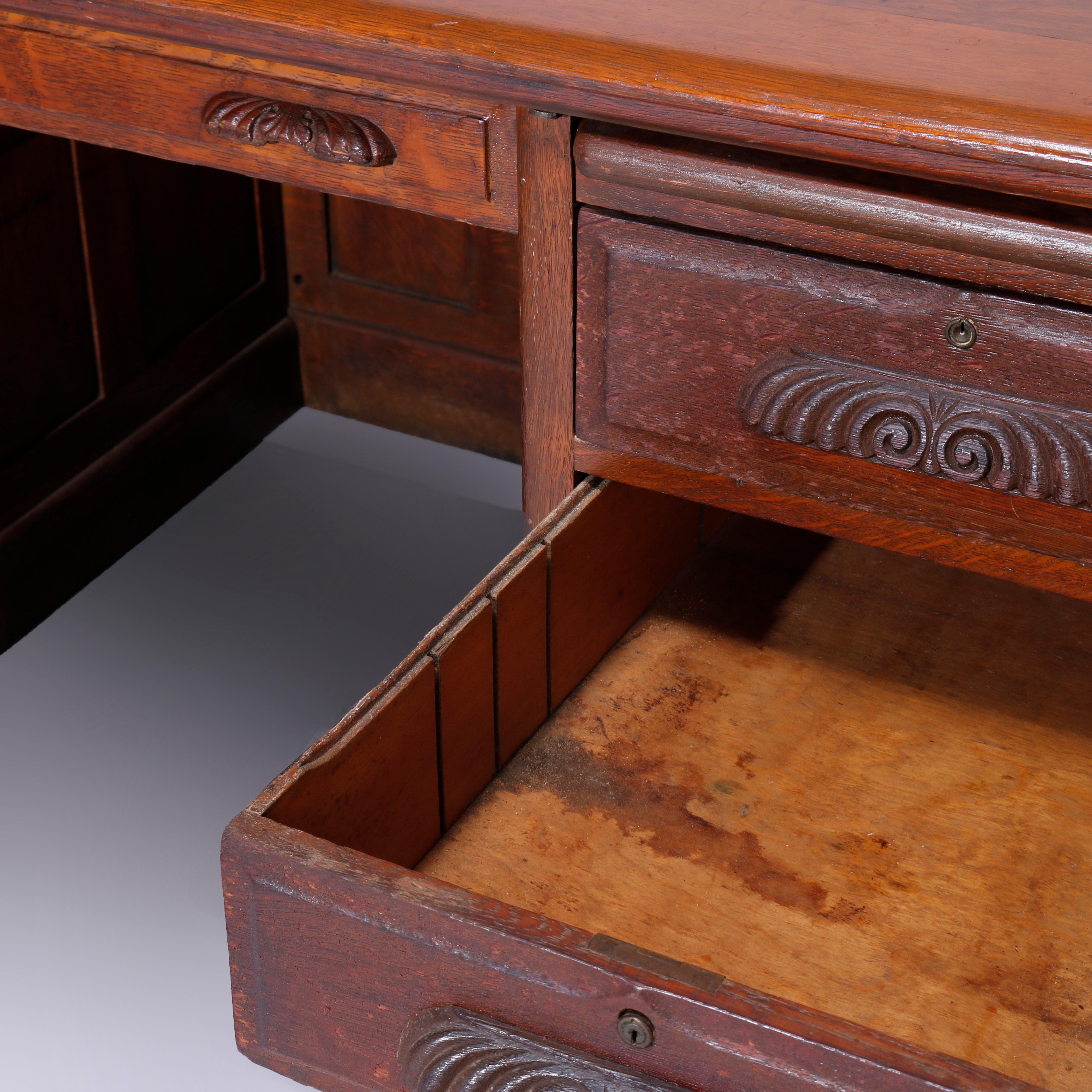 20th Century Antique Quarter Sawn Oak Knee Hole Desk with Raised Panels & Carved Pulls C1900