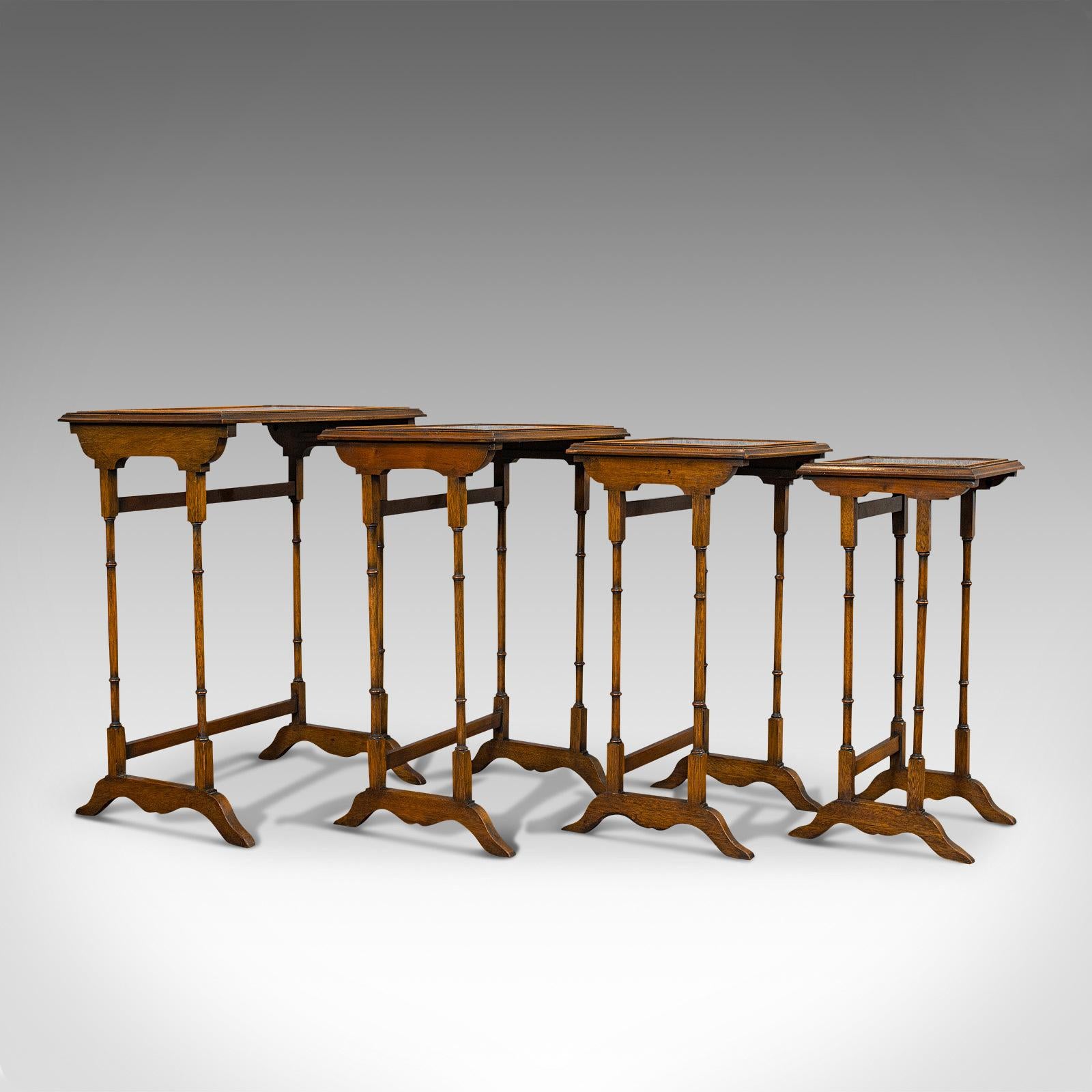 This is an antique quartetto of tables. An English, walnut over mahogany set of nest tables, dating to the Edwardian period, circa 1910.

Of quality craftsmanship, strongly jointed and robust
Displaying a desirable aged patina
Superb walnut with
