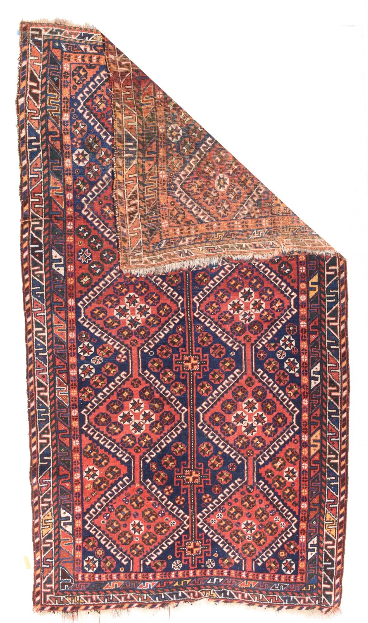 Antique Iran Quashkai Wool on wool 4'8'' x 8'5''. From a neighboring tribal group to the Qashghai of SW Persia, this all-wool construction long rug shows two columns each of five hooked diamonds, which together flank a column of four complete dark