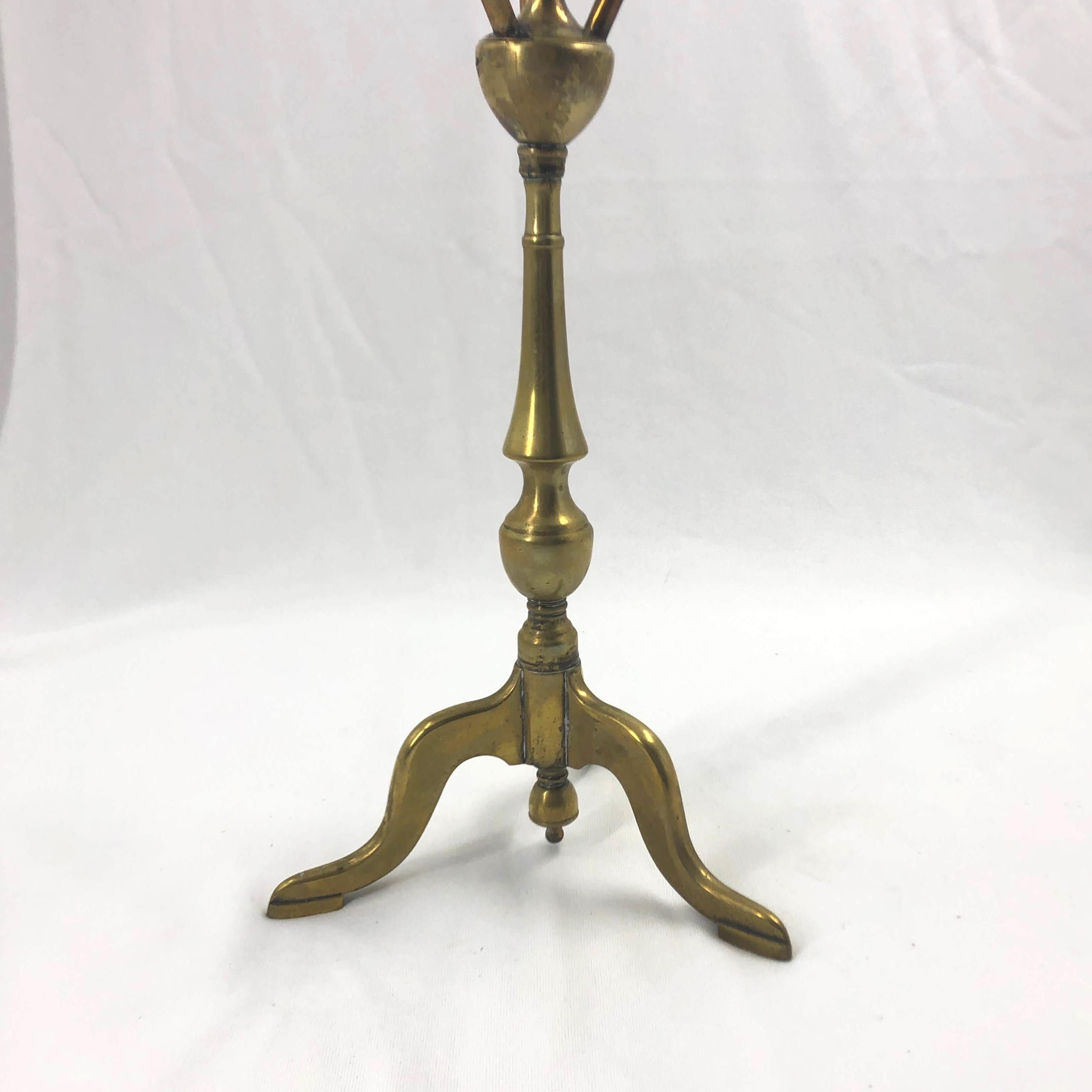 A rare Queen Anne brass cat or wig stand.