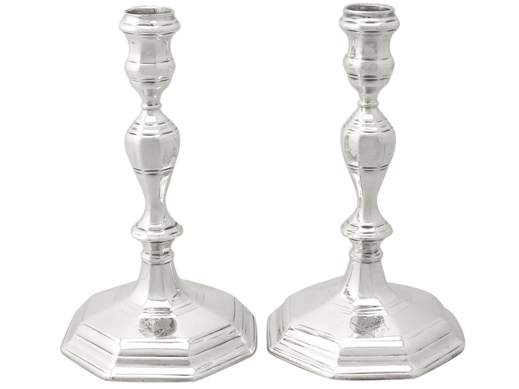 An exceptional, fine and impressive pair of antique English cast Britannia standard silver candlesticks; an addition to our early 18th century silverware collection.

These exceptional antique Britannia silver candlesticks have a plain octagonal