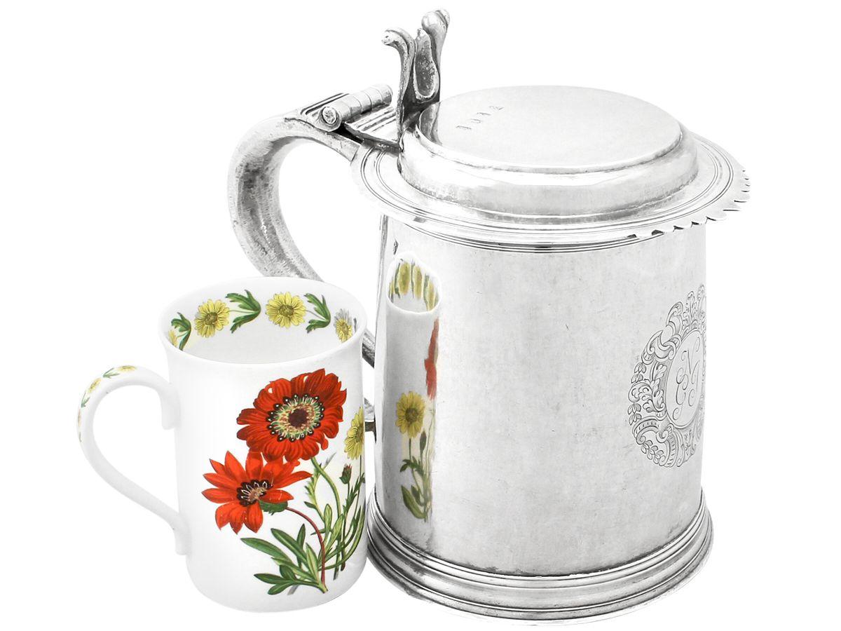 A magnificent, fine and impressive antique Queen Anne English Britannia standard silver flat topped quart and a half tankard; an addition to our range of collectable 18th century silverware.

This magnificent antique Queen Anne Britannia standard