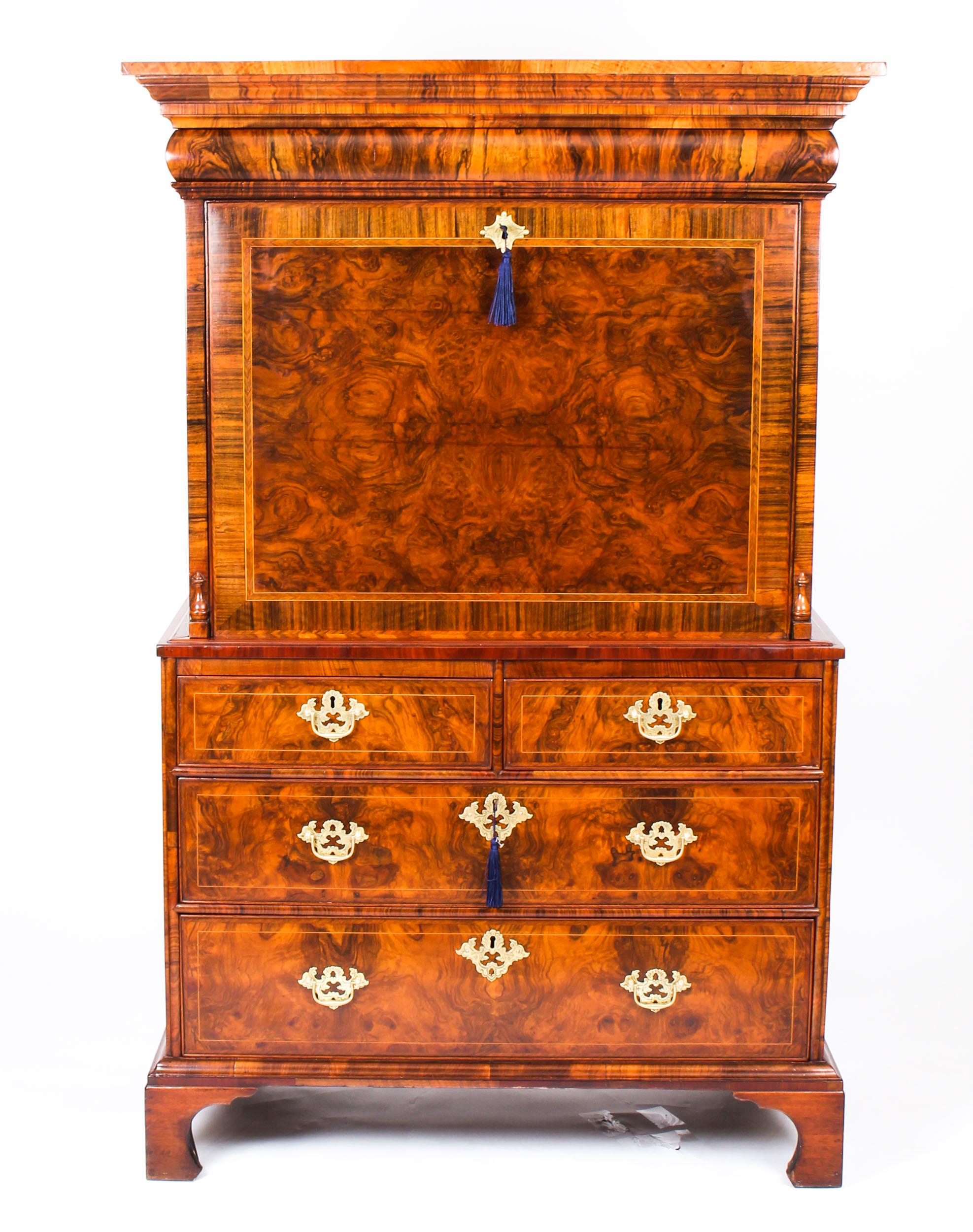Dating from circa 1710, this very special piece of finely crafted furniture is an antique burr walnut Queen Anne secretaire chest / escritoire.
It has a secret cushion moulded drawer in the frieze and the fall front drops down to reveal an inset