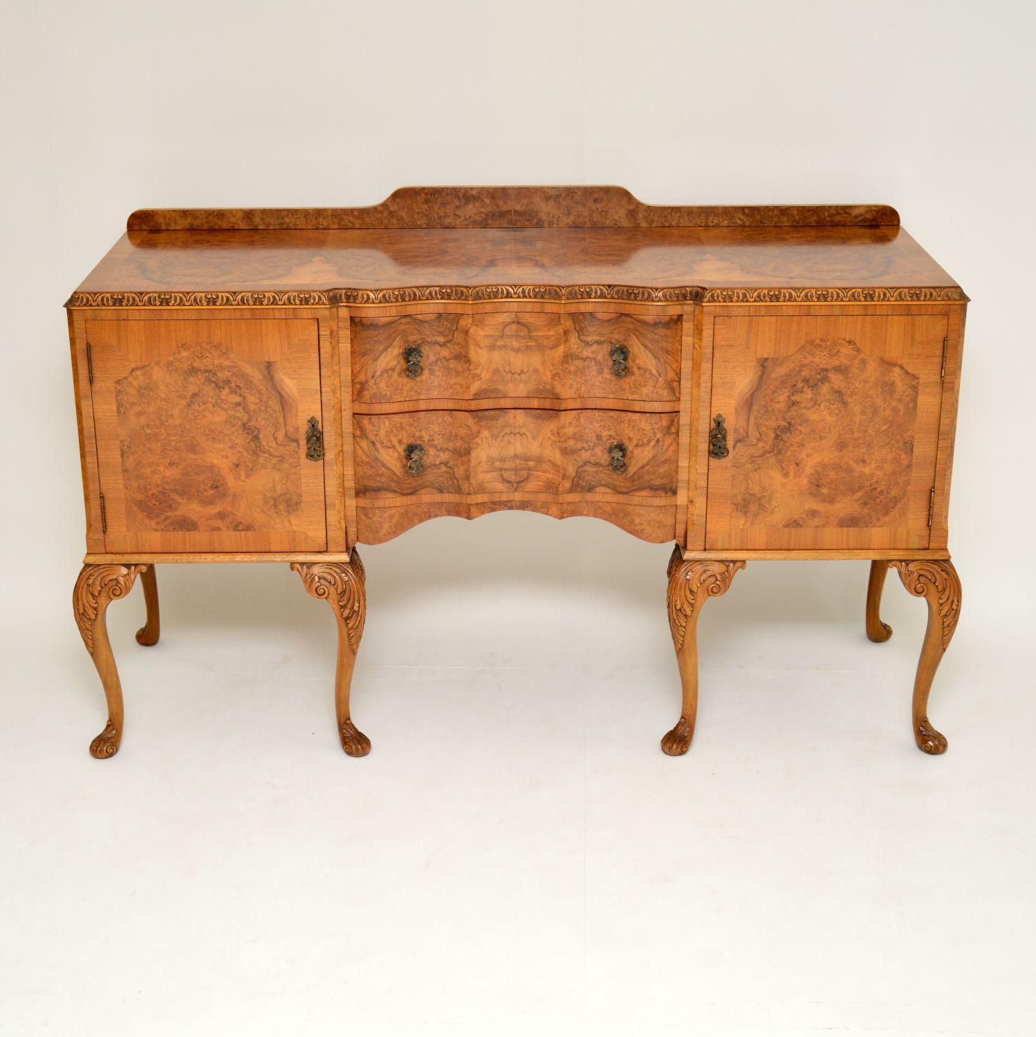 Fabulous quality Queen Anne style walnut sideboard made by H and L Epstein in the 1930s period. It’s in excellent condition and has just been French polished. It has a burr walnut back frieze and top with a cross banded edge. The cupboards have burr