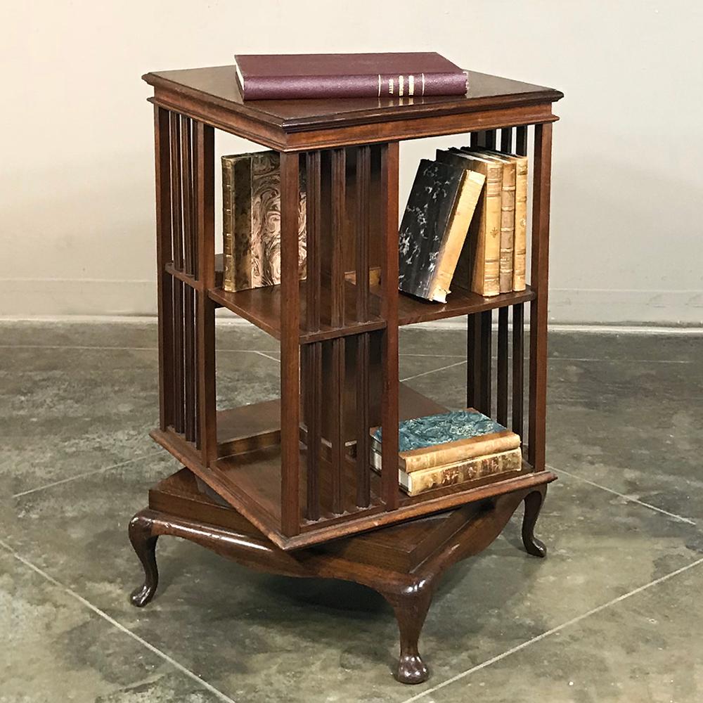 Antique Queen Anne mahogany revolving book stand makes a great end table for your seating group especially for the avid reader! Revolving feature makes it easy to access a wide variety of books all stored in one location, with plenty of room for a