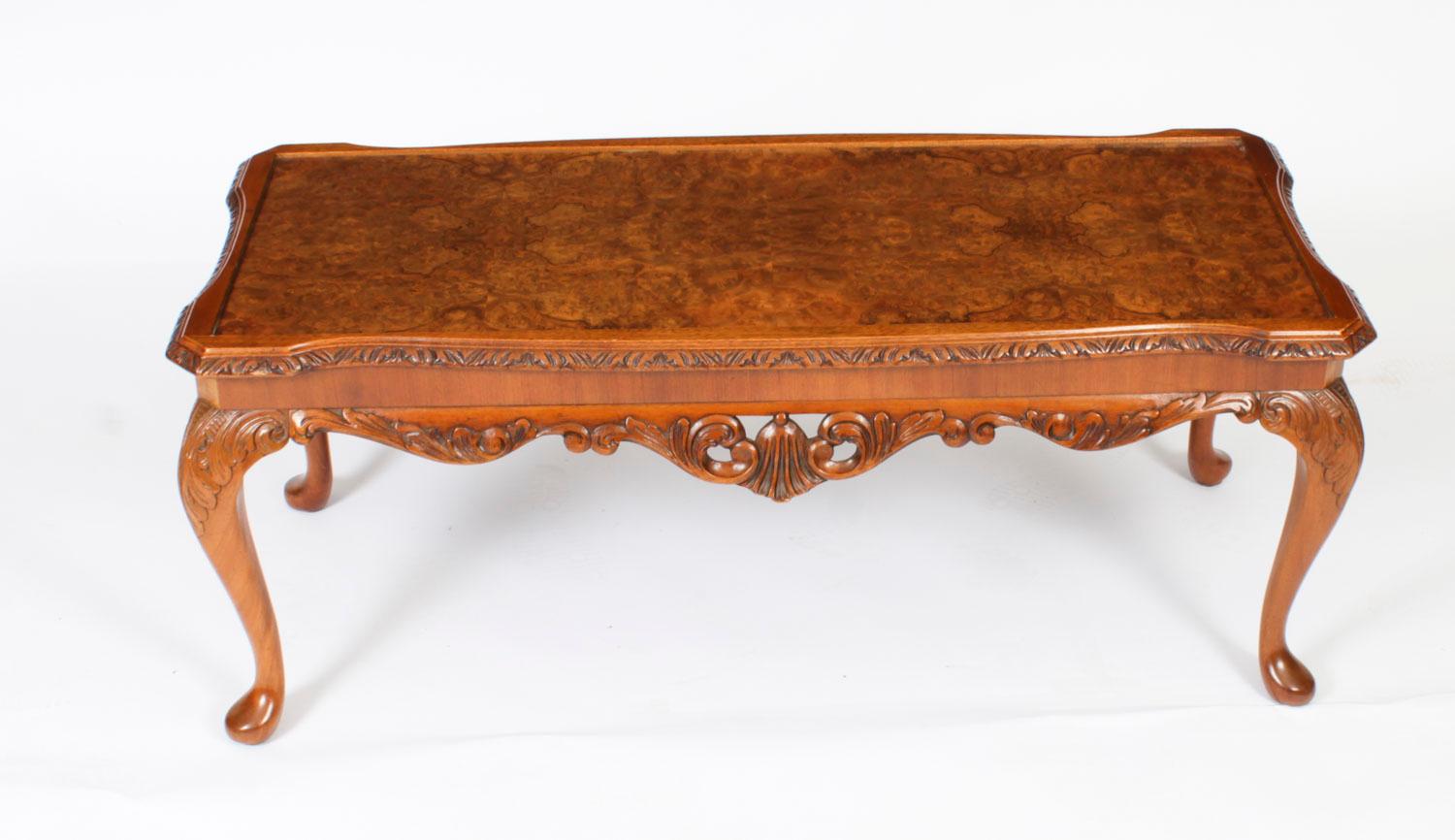This is a stunningly beautiful English antique burr walnut coffee table,  with a beautiful shaped top, circa 1920 in date.  

It features a shaped top with a banded border and a carved edge. The shaped frieze standing on well carved cabriole legs.