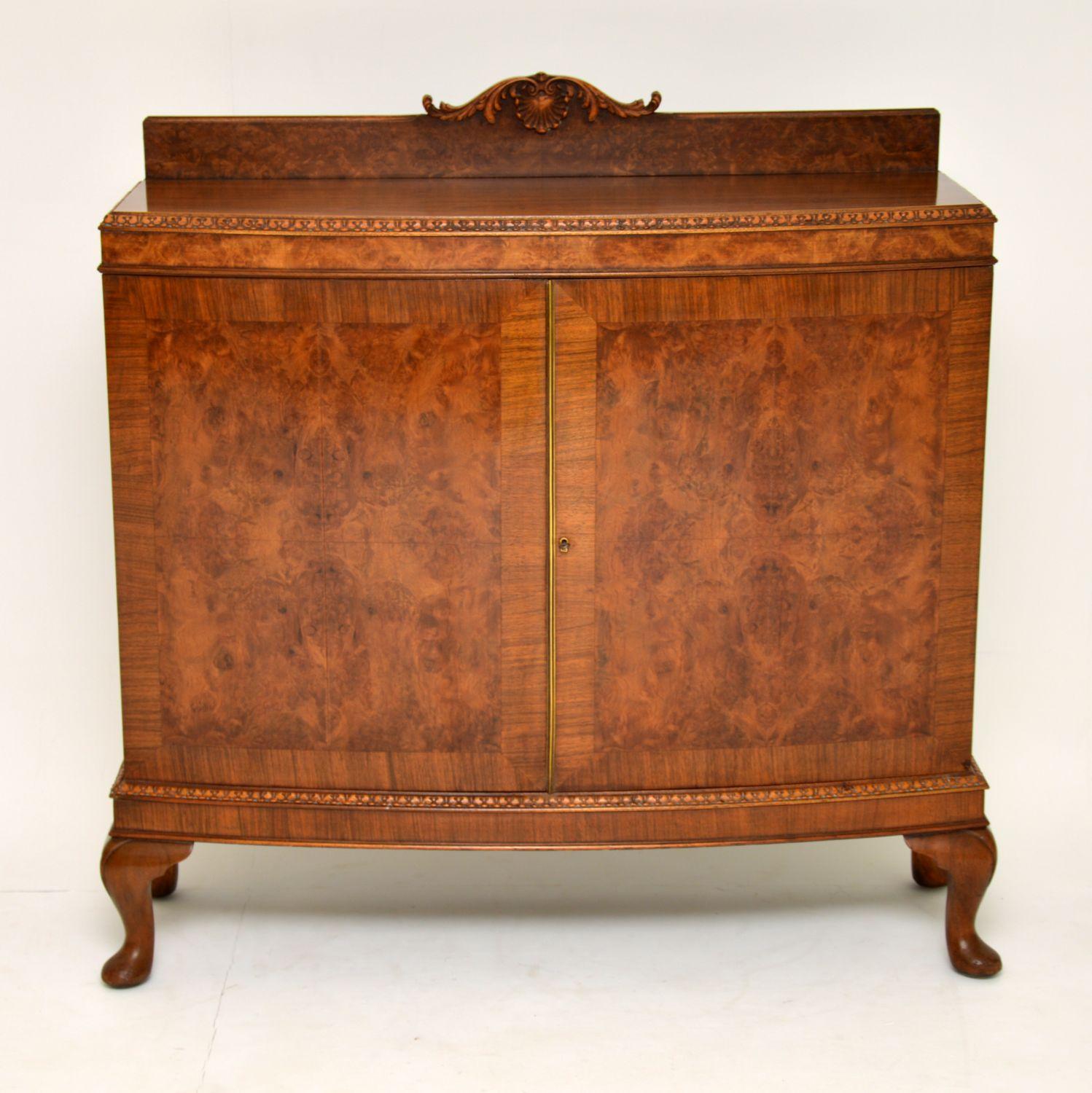 This antique walnut bow fronted cabinet is fine quality and is a very practicable item of furniture. It’s quite slim from back to front and has plenty of useful storage inside. The top back section is burr walnut and has some beautiful carving on