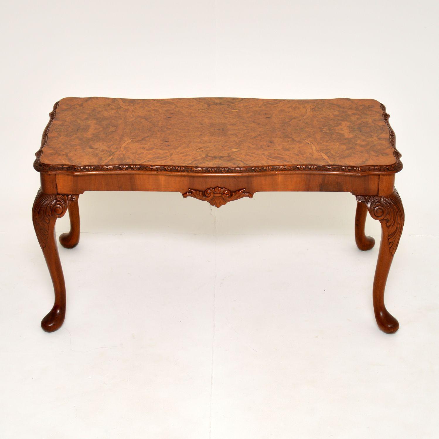 A stunning burr walnut coffee table in the antique Queen Anne style. This was made in England, it dates from the 1930’s.

It is of amazing quality, with a beautiful serpentine shape and stunning burr walnut veneers. There is wonderful crisp