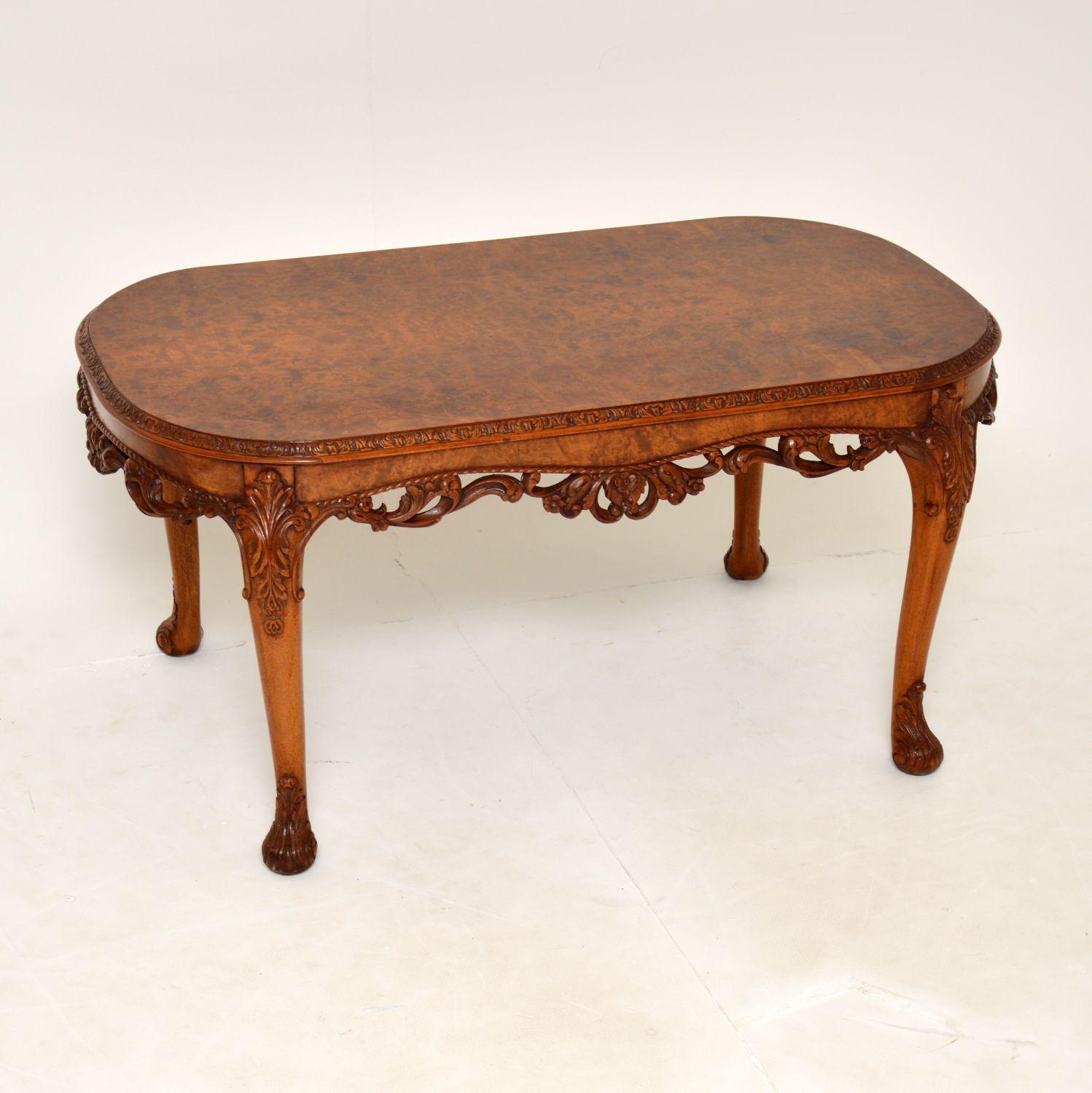 A fantastic antique burr walnut coffee table of the highest order. This was made made in England, it dates from the 1930’s.

The quality is outstanding, this is a great size and has absolutely gorgeous carving all over the edges and legs. The top
