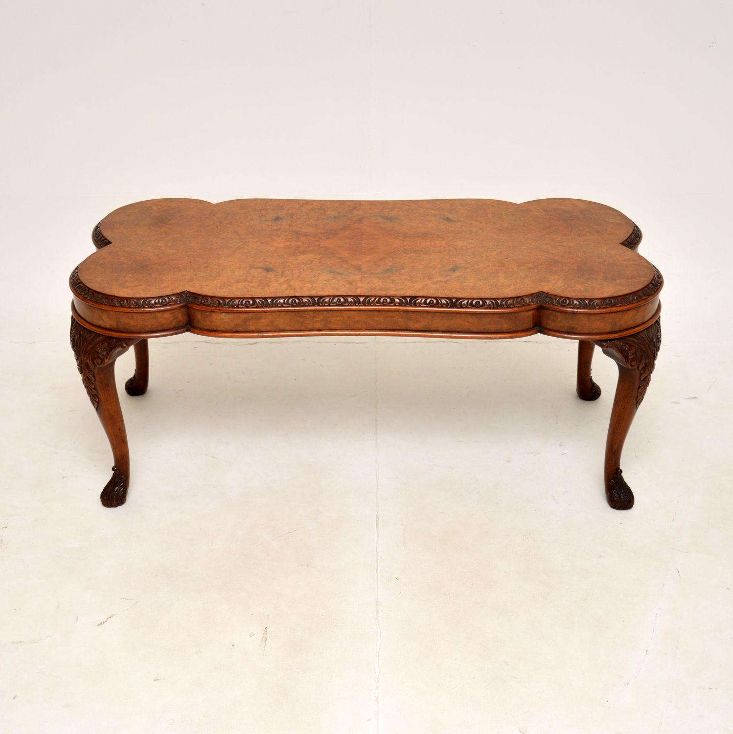 A stunning antique Queen Anne style burr walnut coffee table. This was made in England, it dates from around the 1930’s.

It is of amazing quality, the top has a gorgeous shape with curvaceous edges. The top edge is beautifully carved, there is also