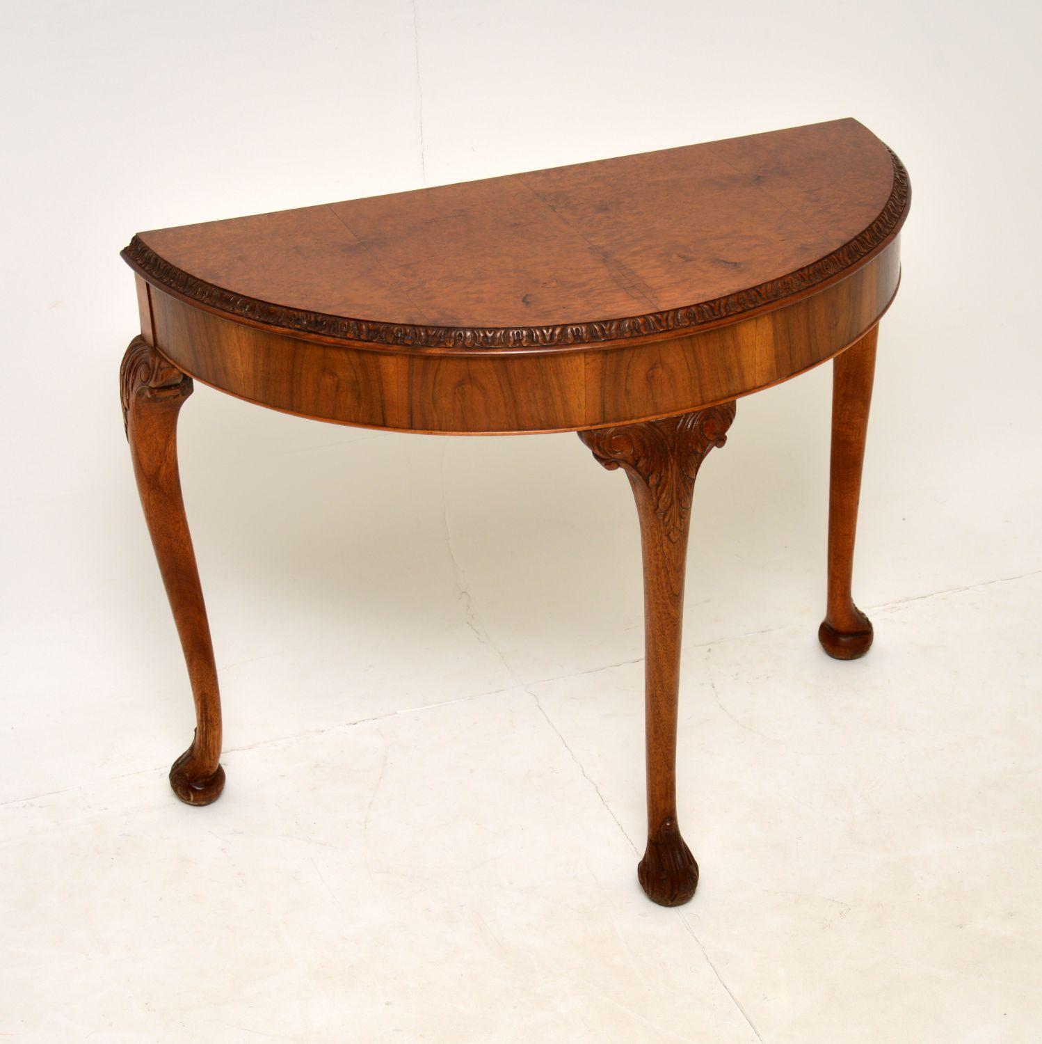 A beautiful burr walnut console side table, in the antique Queen Anne style. This dates from the 1930’s, it was made in England.

The quality is excellent, and it is a useful size. There are gorgeous burr walnut grain patterns, the colour is