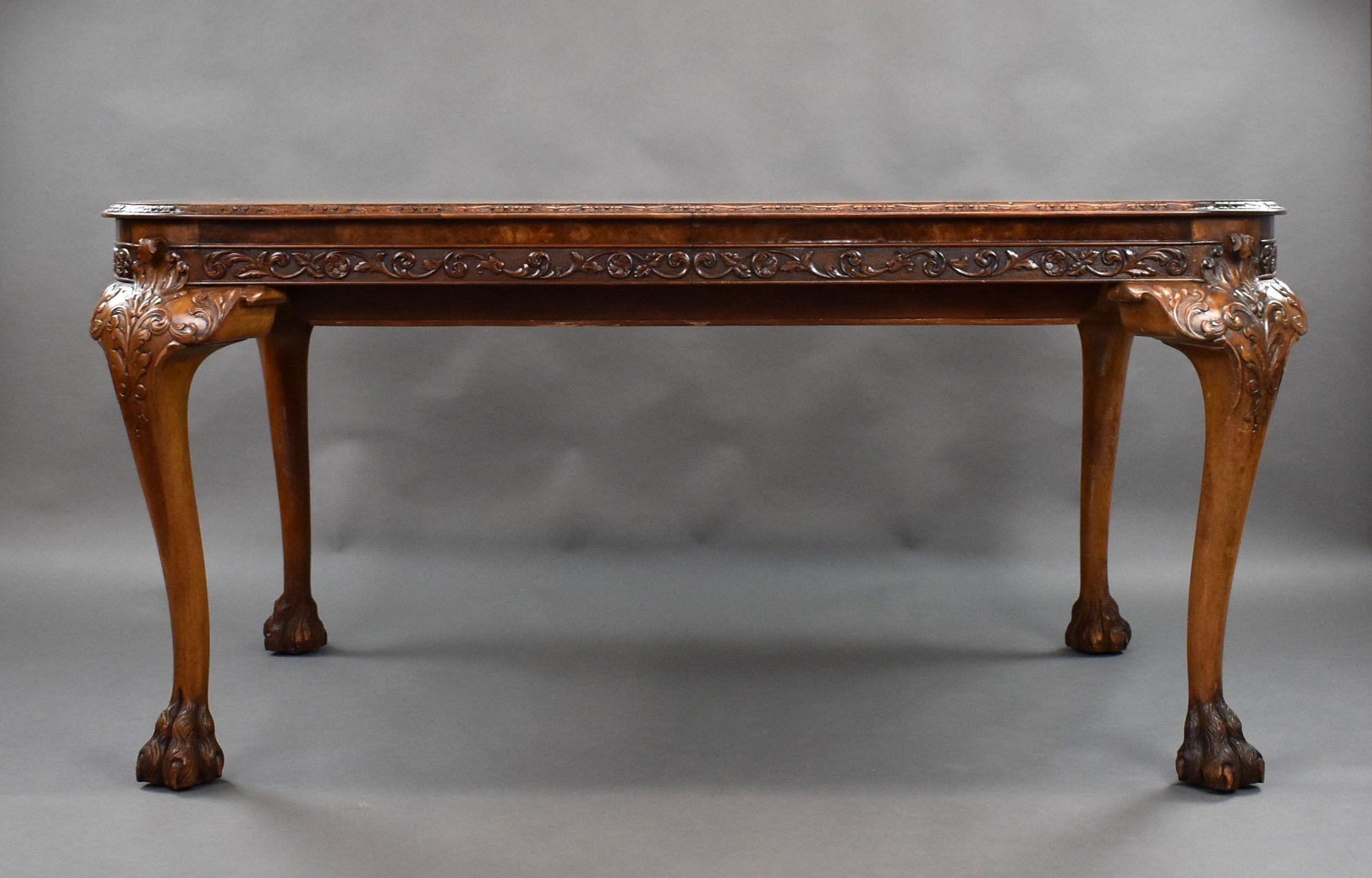 For sale is a good quality Queen Anne style burr walnut extending dining table, having a well figured top, with an additional leaf, standing on four elegant cabriole legs, each heavily carved terminating on paw feet. The leaf can be stored under the