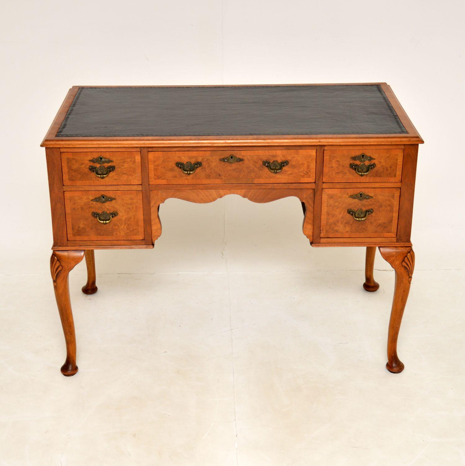 A beautiful antique Queen Anne style desk in walnut. This was made in England, it dates from around the 1920’s period.
The quality is excellent and this is a very useful size; compact yet with plenty of workspace and storage space. There are