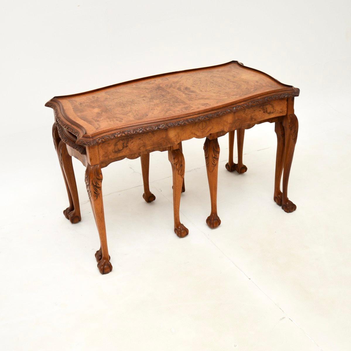 A beautiful antique Queen Anne style burr walnut nesting coffee table. They were made in England, and date from around the 1930’s.

They are of superb quality with a fantastic space saving design. They have crisp carving at the edges, acanthus leaf