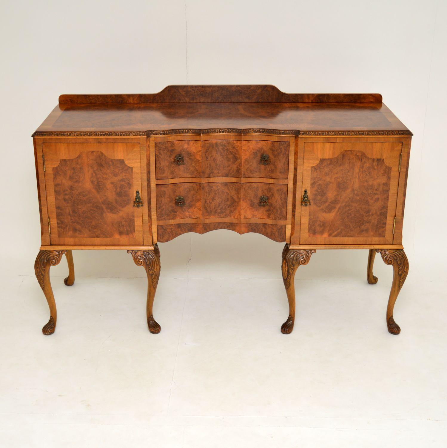 A stunning antique sideboard in the Queen Anne style, beautifully made from burr walnut. This dates from the 1920s-1930s and is of superb quality. We are fairly sure this was made by H & L Epstein, who were high end furniture makers in