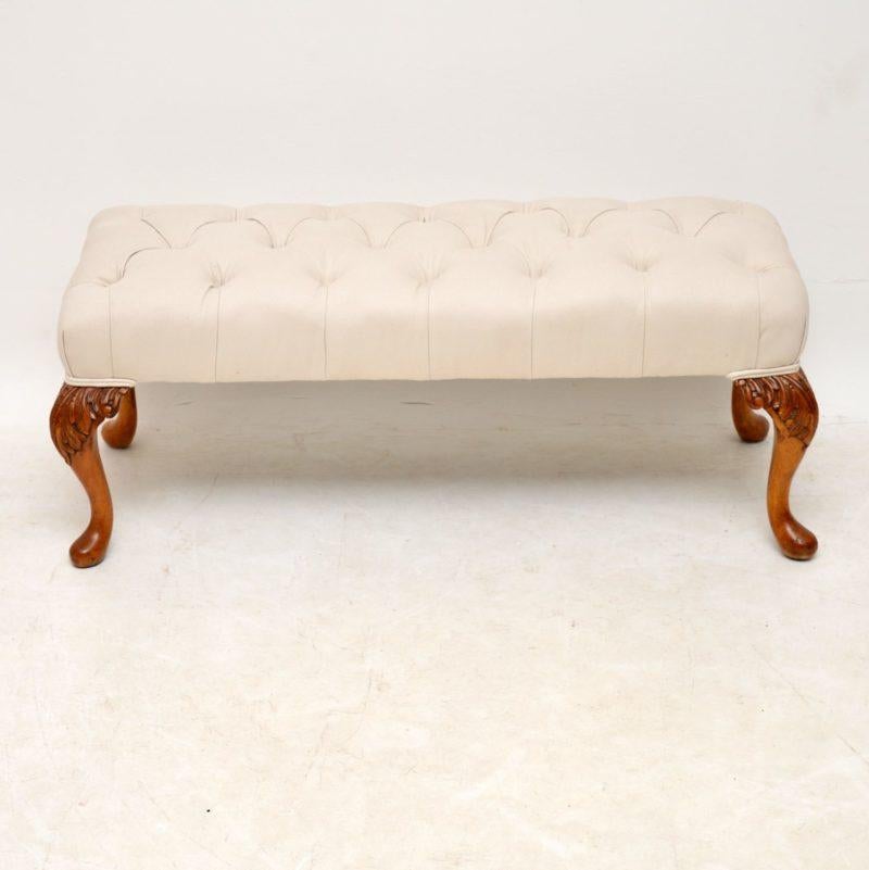Antique Queen Anne style upholstered stool with deep buttoned upholstery and carved walnut legs. It’s just been French polished and re-upholstered in our regular cream cotton linen fabric. I would date this stool to circa 1930s period and it’s in