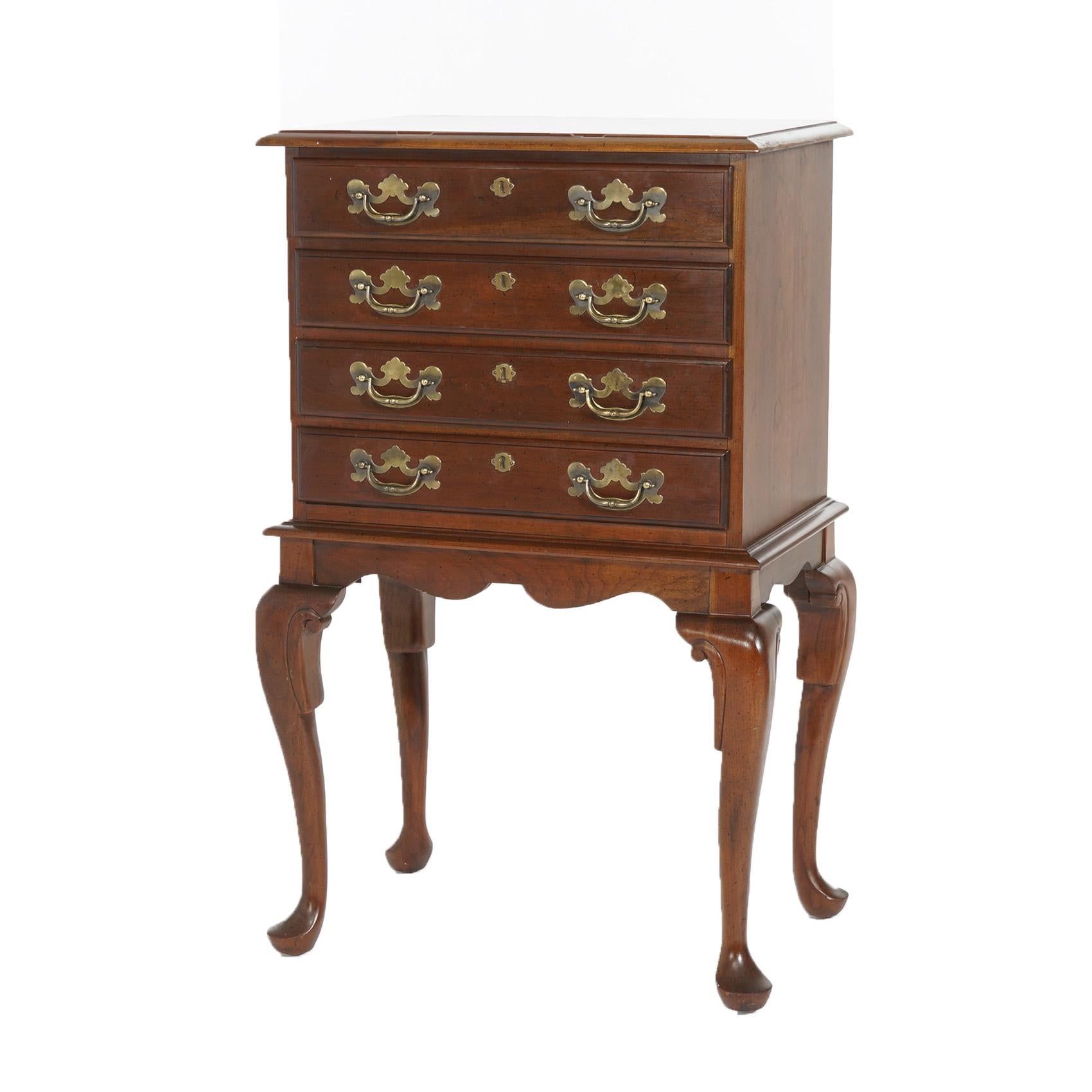***Ask About Discounted In-House Shipping***
An antique Queen Anne style silver chest offers cherry construction with beveled top over chest having four drawers, raised on cabriole legs terminating in pad feet, cast brass hardware throughout,