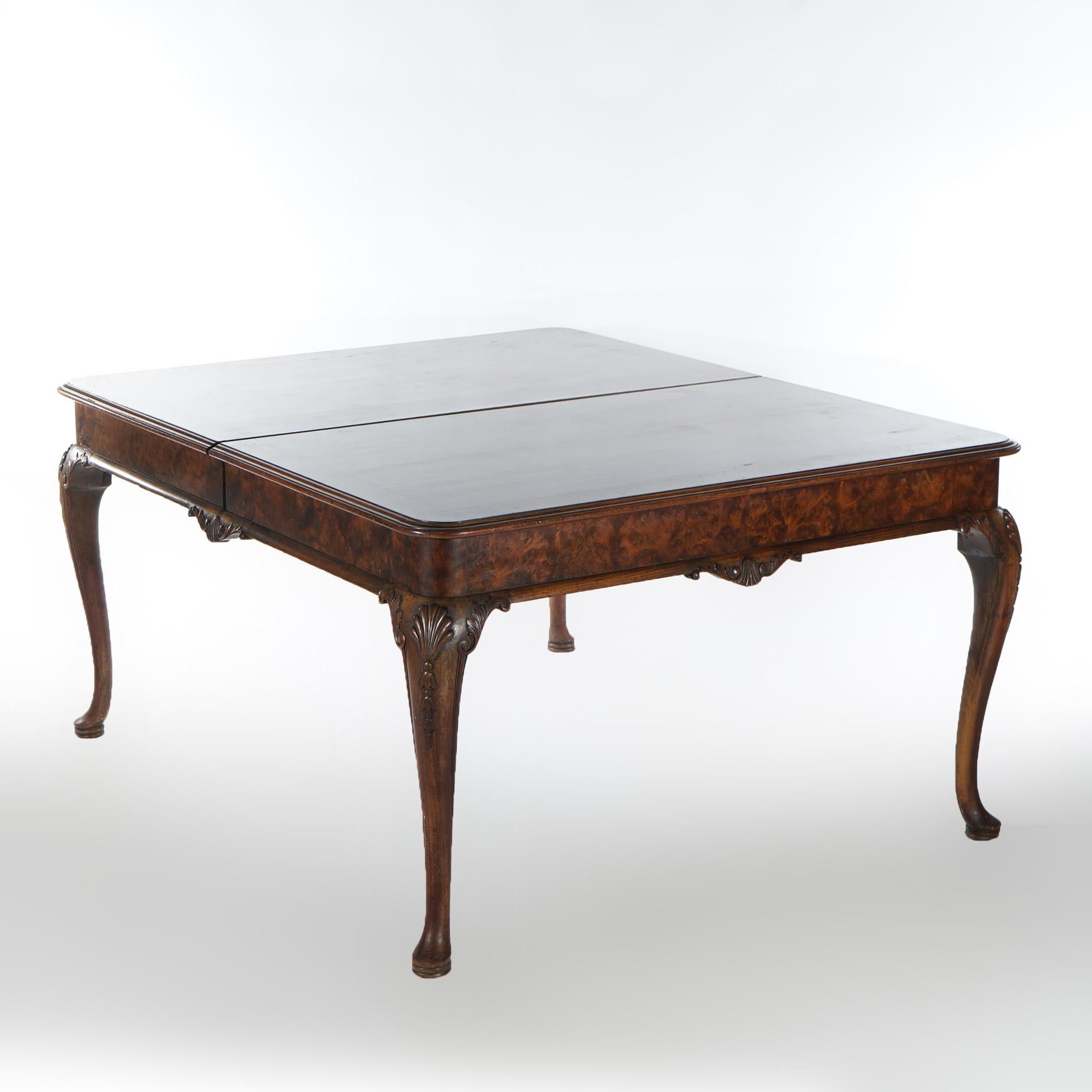 A Queen Anne style extension dining table offers mahogany construction with inlaid banding, shaped skirt and raised on cabriole legs terminating in pad feet; includes and accepts two skirted leaves, c1930

Measures - 30