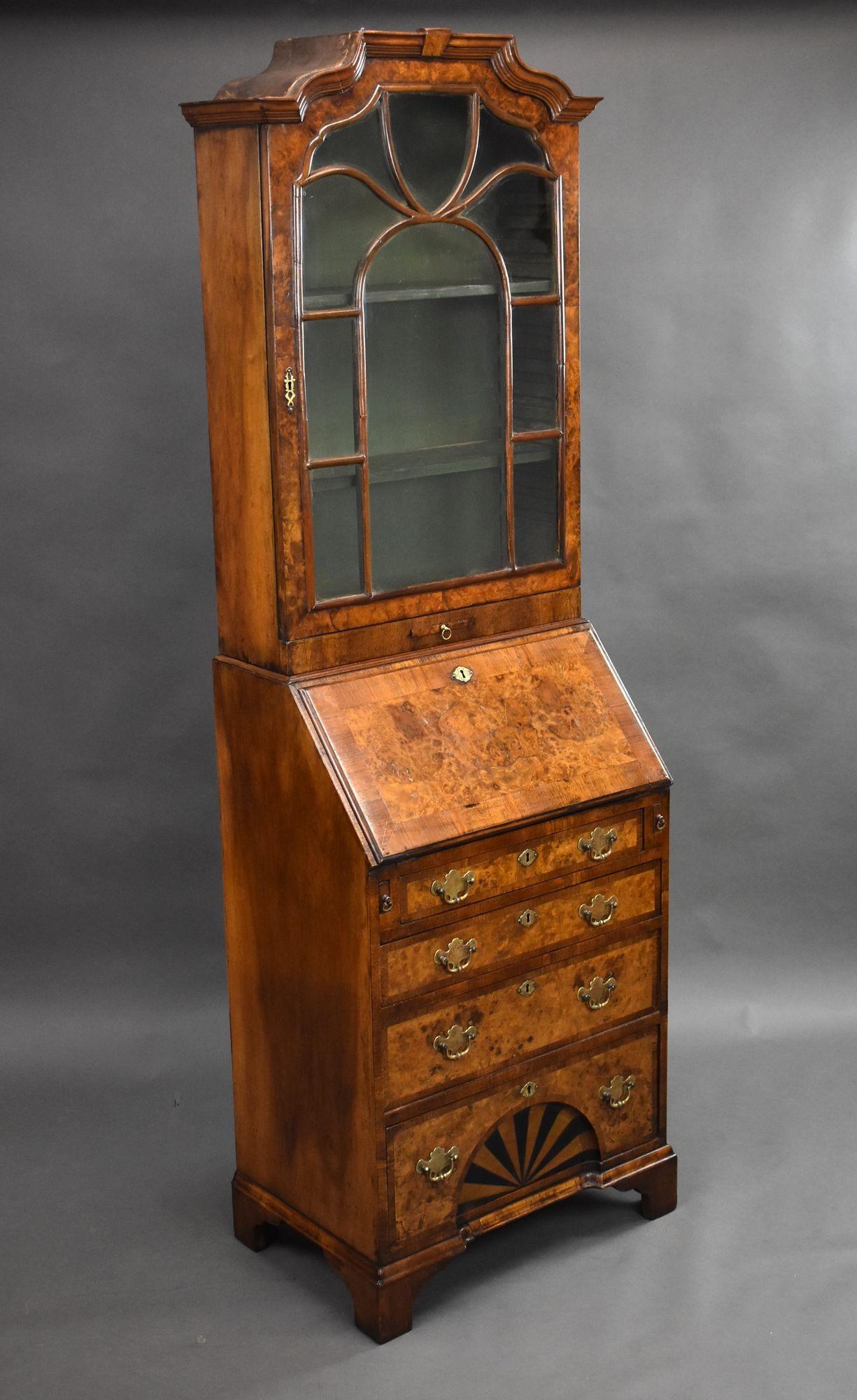 For sale is a good quality antique Queen Anne style burr walnut bureau bookcase, having a glazed top with adjustable shelves, above a bureau base, with the fall opening to a fully fitted interior over four graduated drawers. The bookcase stands on