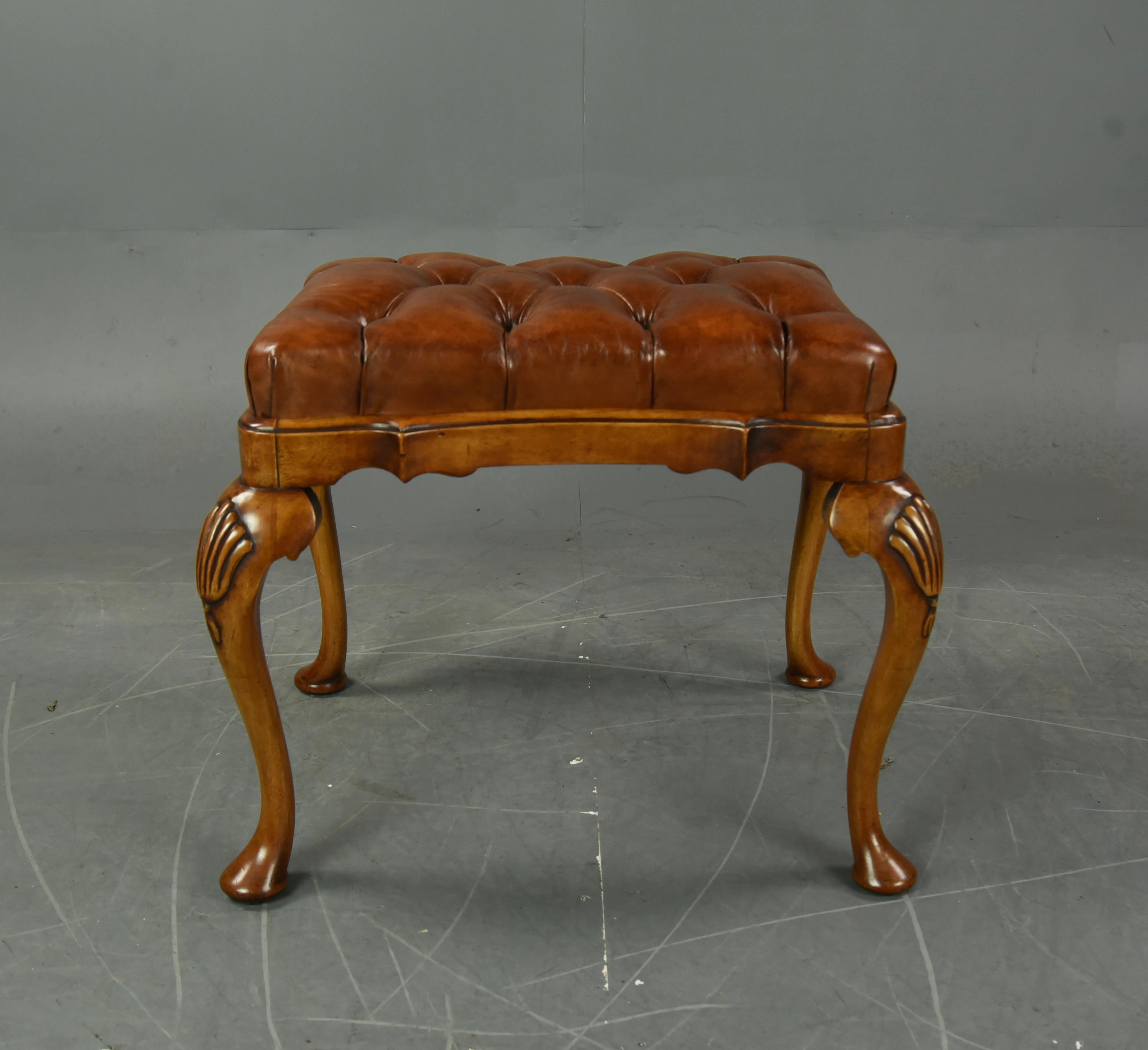 Wonderful Queen Anne style walnut stool.
The stool has very elegant Queen Anne style legs with carved shell knees.
The Stool has a luxurious deep buttoned hand dyed leather drop seat.
The stool is very sturdy with no loose joints and in great