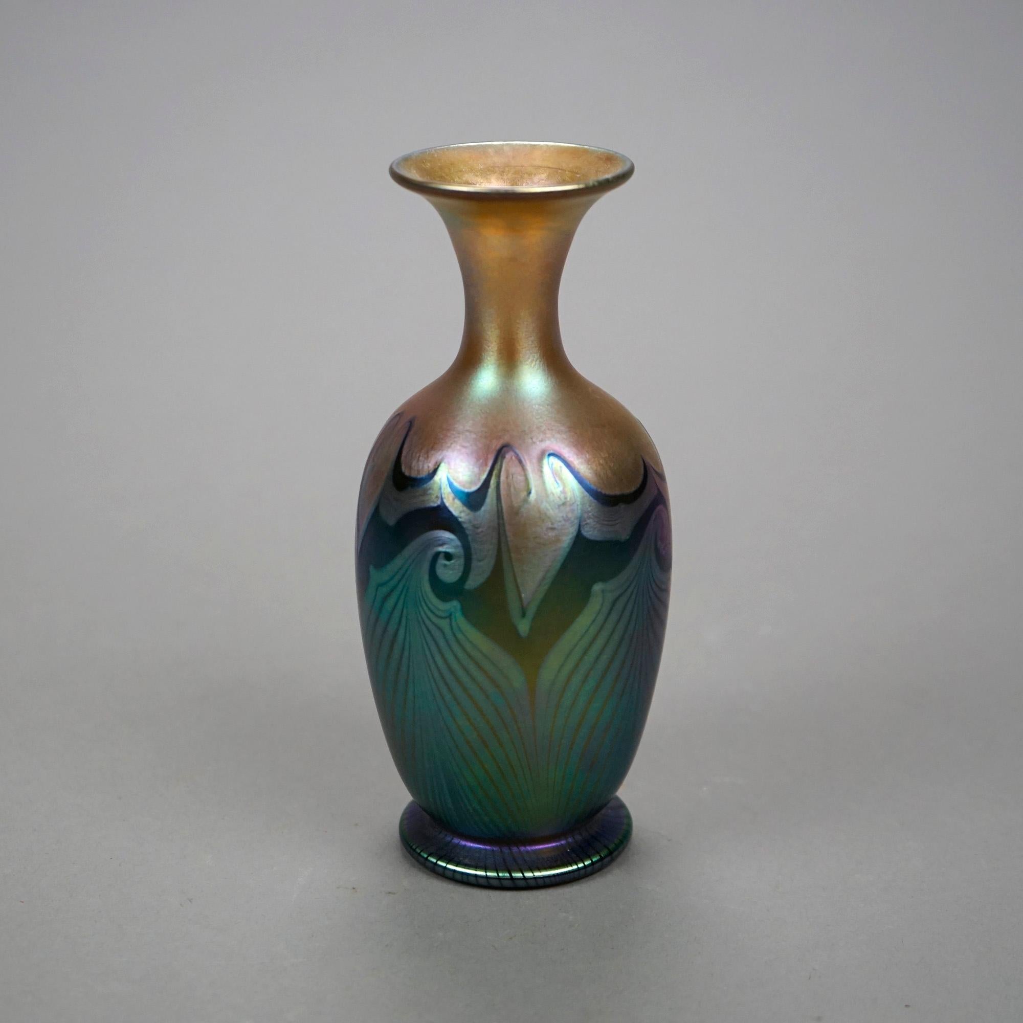 An antique Art Nouveau vase by Quezal offers art glass construction in pulled feather design, signed on base as photographed, c1920

Measures- 6.75''H x 3''W x 3''D

Catalogue Note: Ask about DISCOUNTED DELIVERY RATES available to most regions