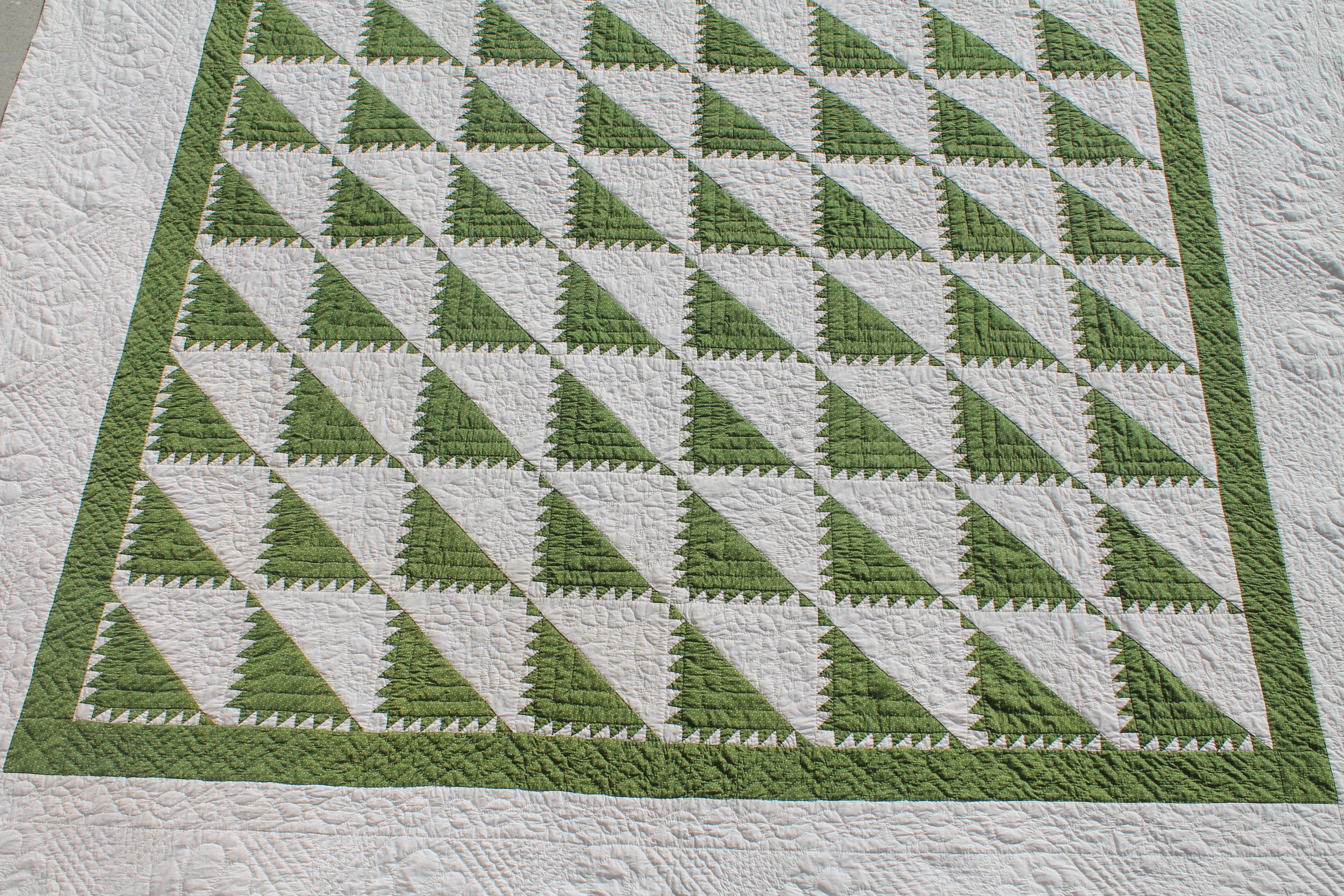 This amazing king size 19th century green and white delectable mountain pattern quilt is in pristine condition. The finest of quilting and piece work. This quilt is quite unusual size and condition.