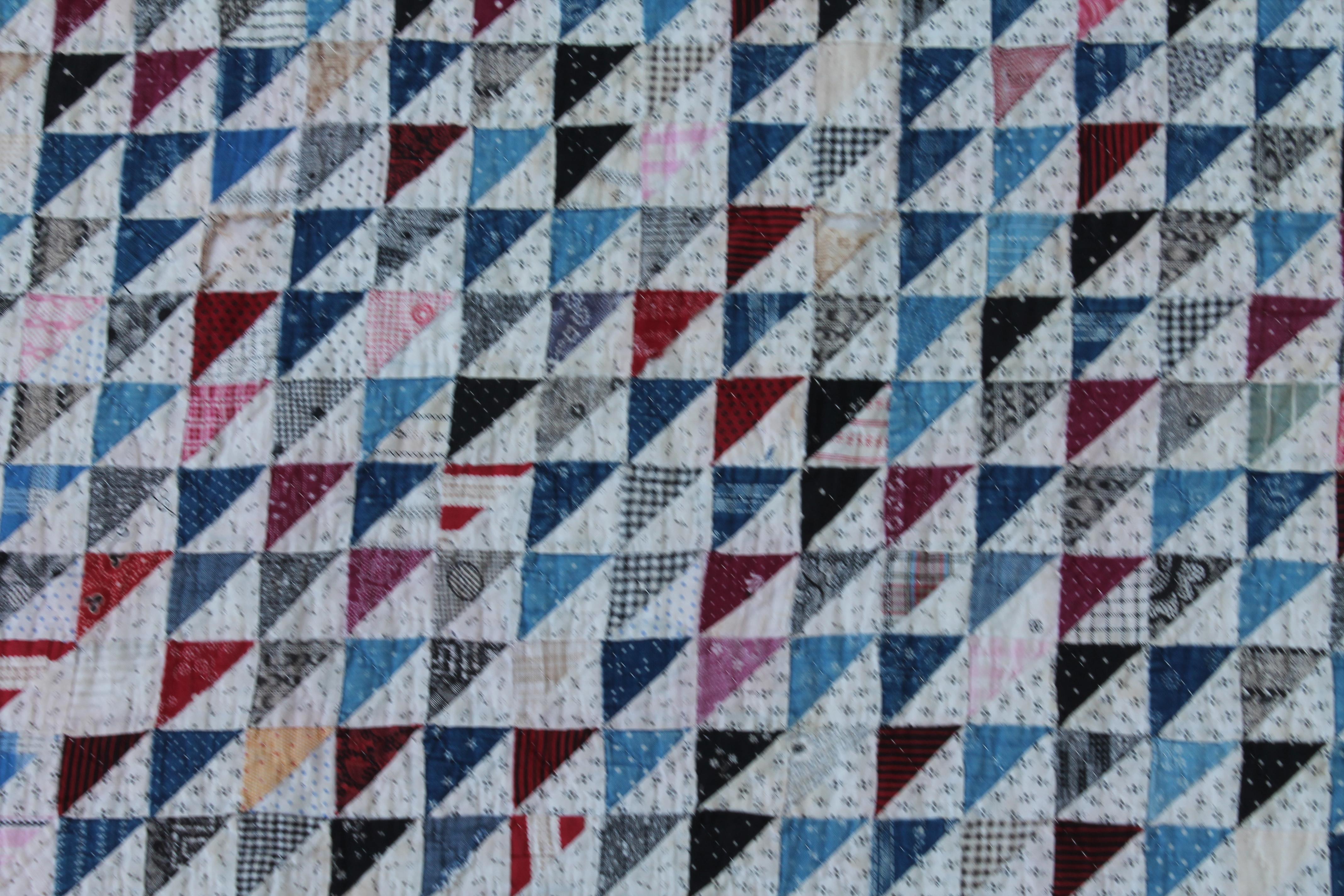 Antique mini pieced triangles quilt in good condition and amazing piecework as well. The backing is in a plain simple printed fabric. This is a real collectors quilt.