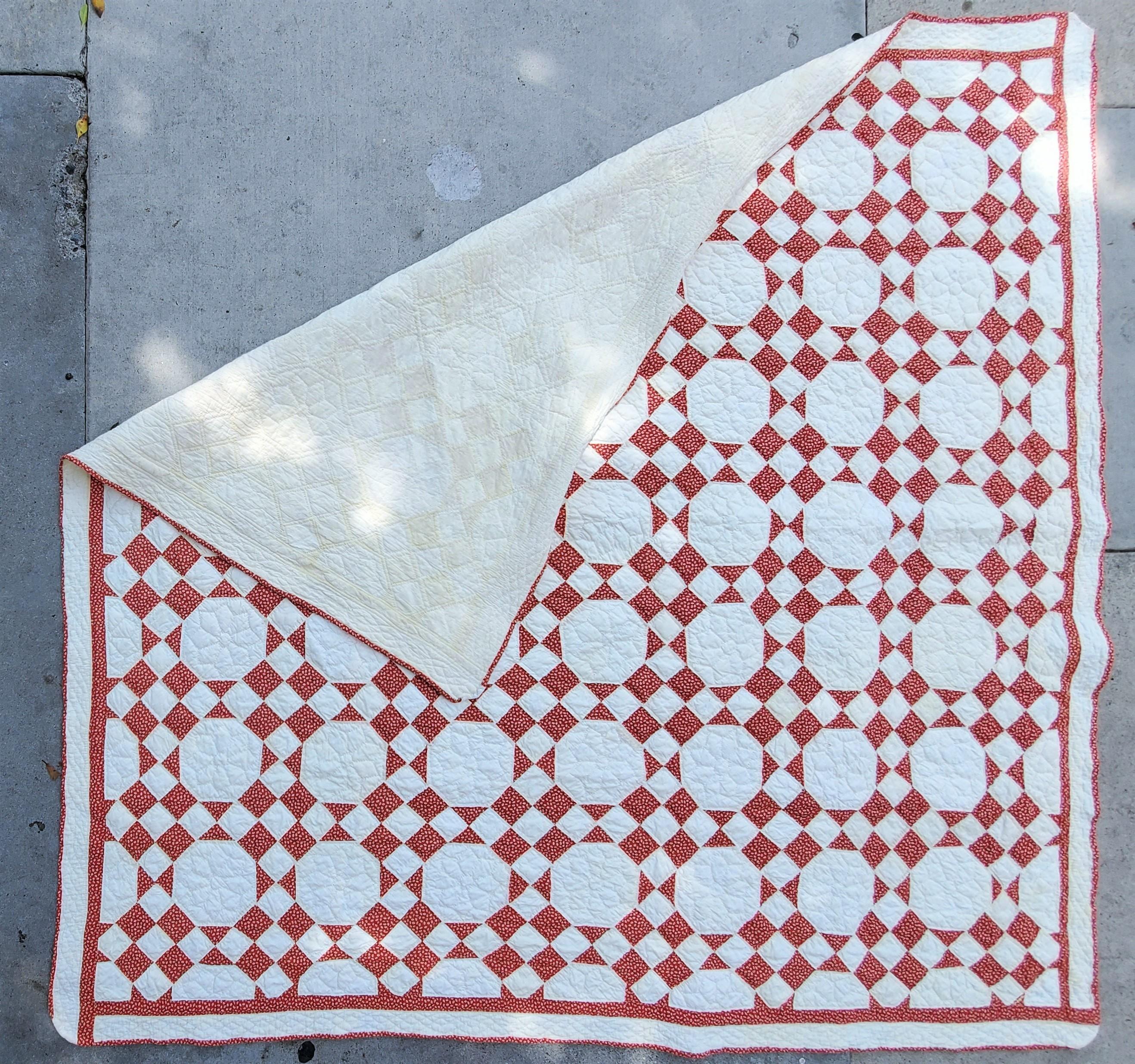 This fine calico nine patch quilt was found in Pennsylvania and is in good condition. The rust calico is typical Pennsylvania fabric.