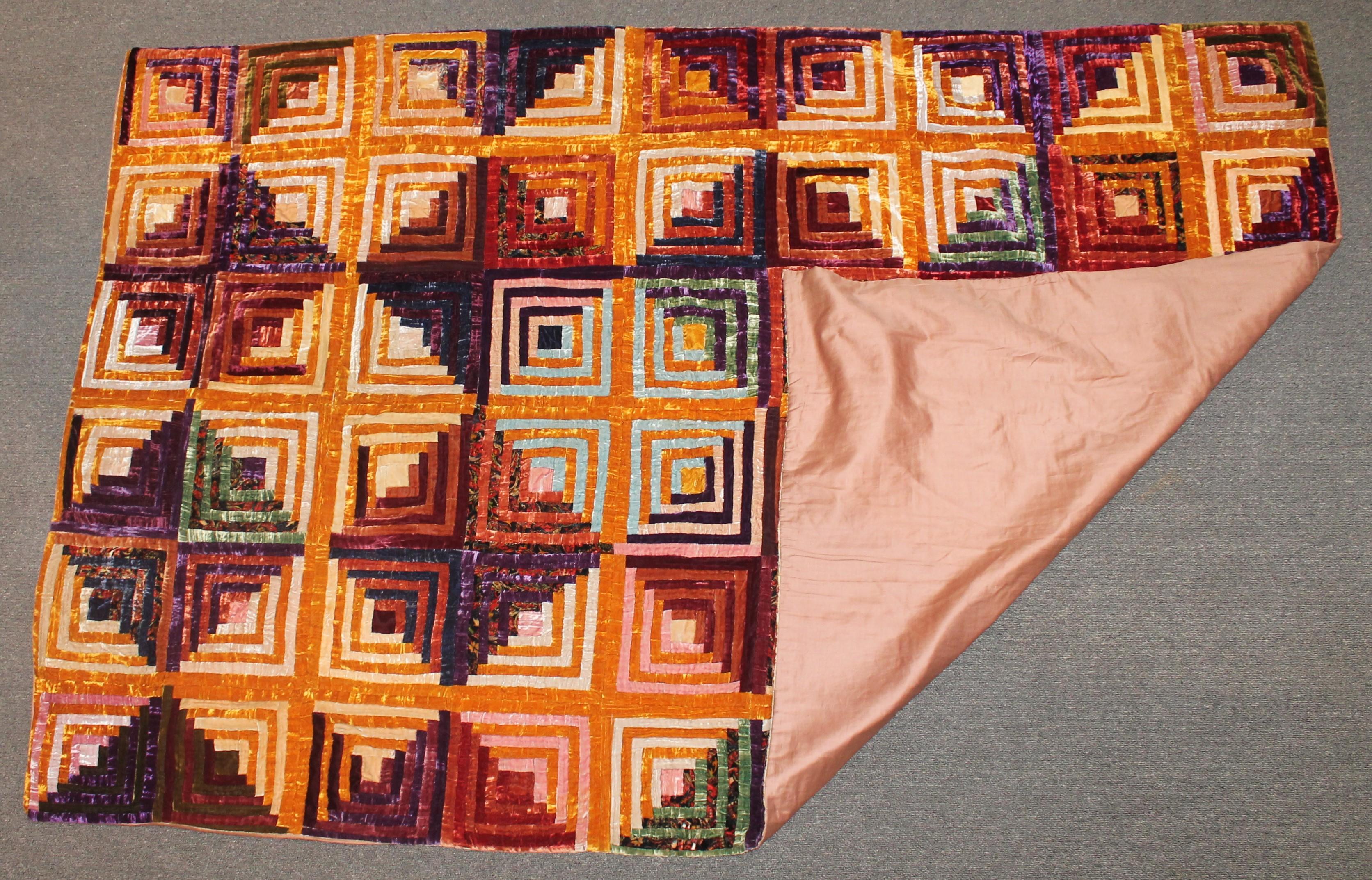 Antique velvet log cabin quilt in very good condition. This vibrant silk velvet quilt is very graphic.