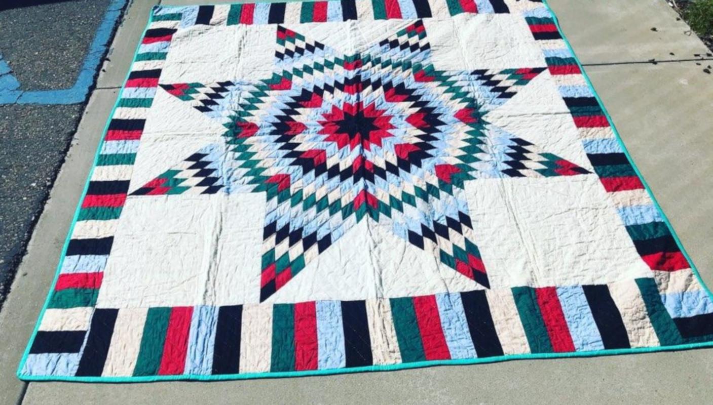 This folky five color star quilt is in fine condition and has a roman striped border. The piece work is very good with nice tight stitching. This is a pristine quilt and has never been used or washed. No stains or damages. Found in Texas.